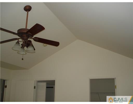 168 Salem Road North Brunswick, NJ 08902 - Photo 11 of 20 a view of a room with a ceiling fan and kitchen view