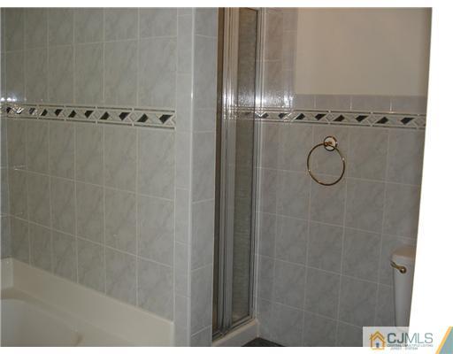 168 Salem Road North Brunswick, NJ 08902 - Photo 12 of 20 a bathroom with a granite countertop shower and a mirror