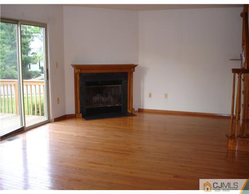 168 Salem Road North Brunswick, NJ 08902 - Photo 5 of 20 a view of empty room with window and fireplace