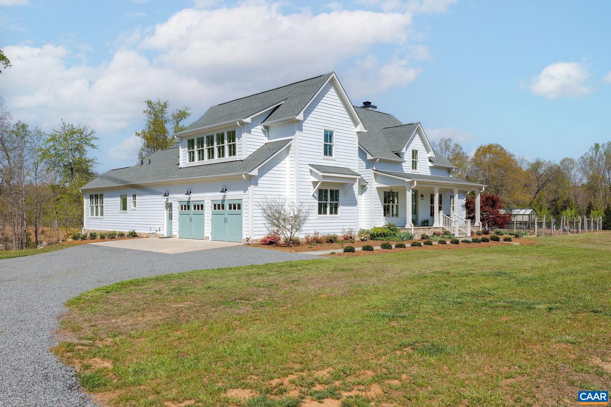 4764 Advance Mills Road Earlysville, VA 22936 - Photo 3 of 72 a front view of a house with a garden