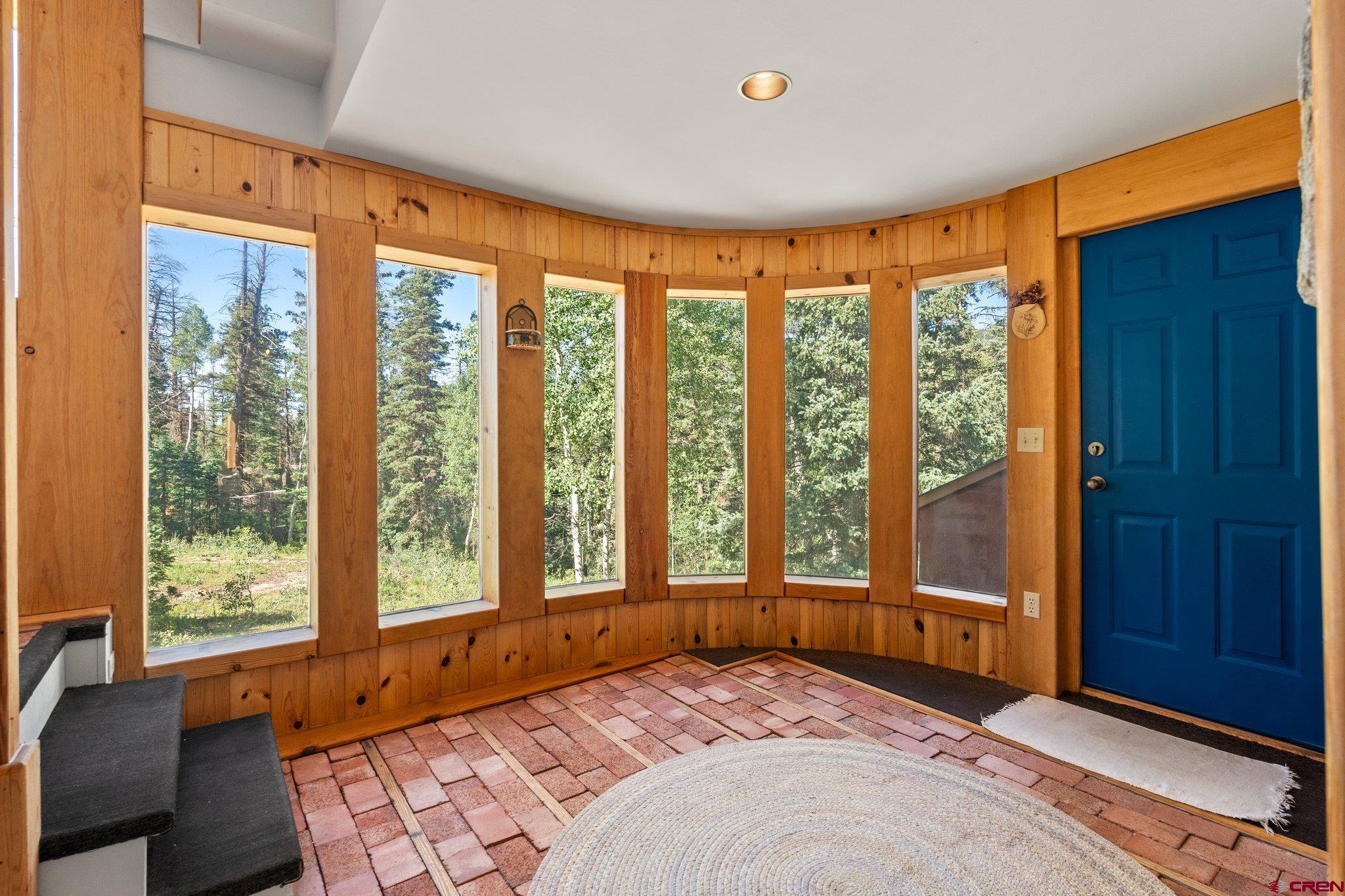 1389 County Road 240 Durango, CO 81301 - Photo 12 of 35 a bedroom with a large window and a bed