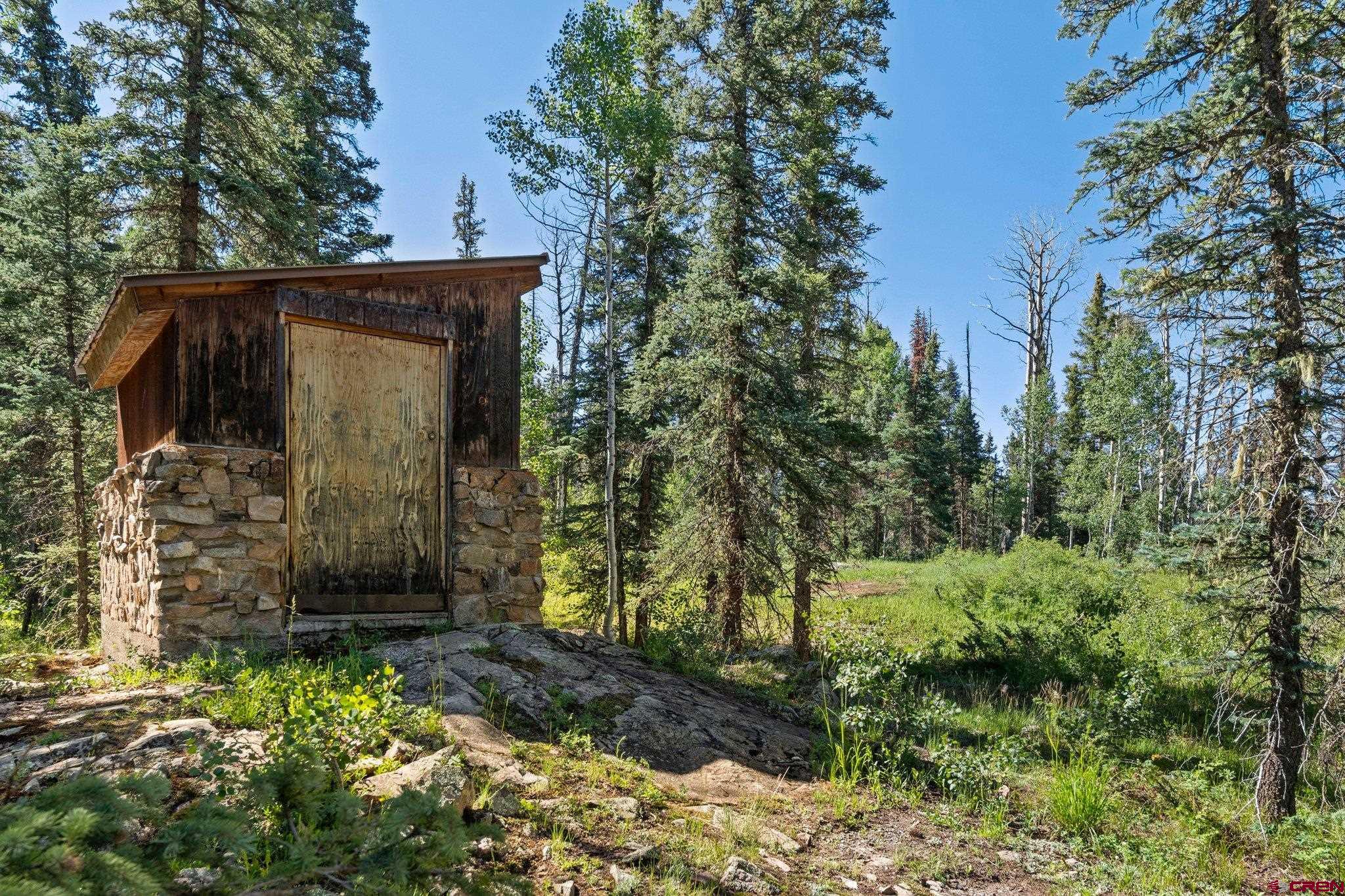 1389 County Road 240 Durango, CO 81301 - Photo 15 of 35 a view of a wooden door and a yard