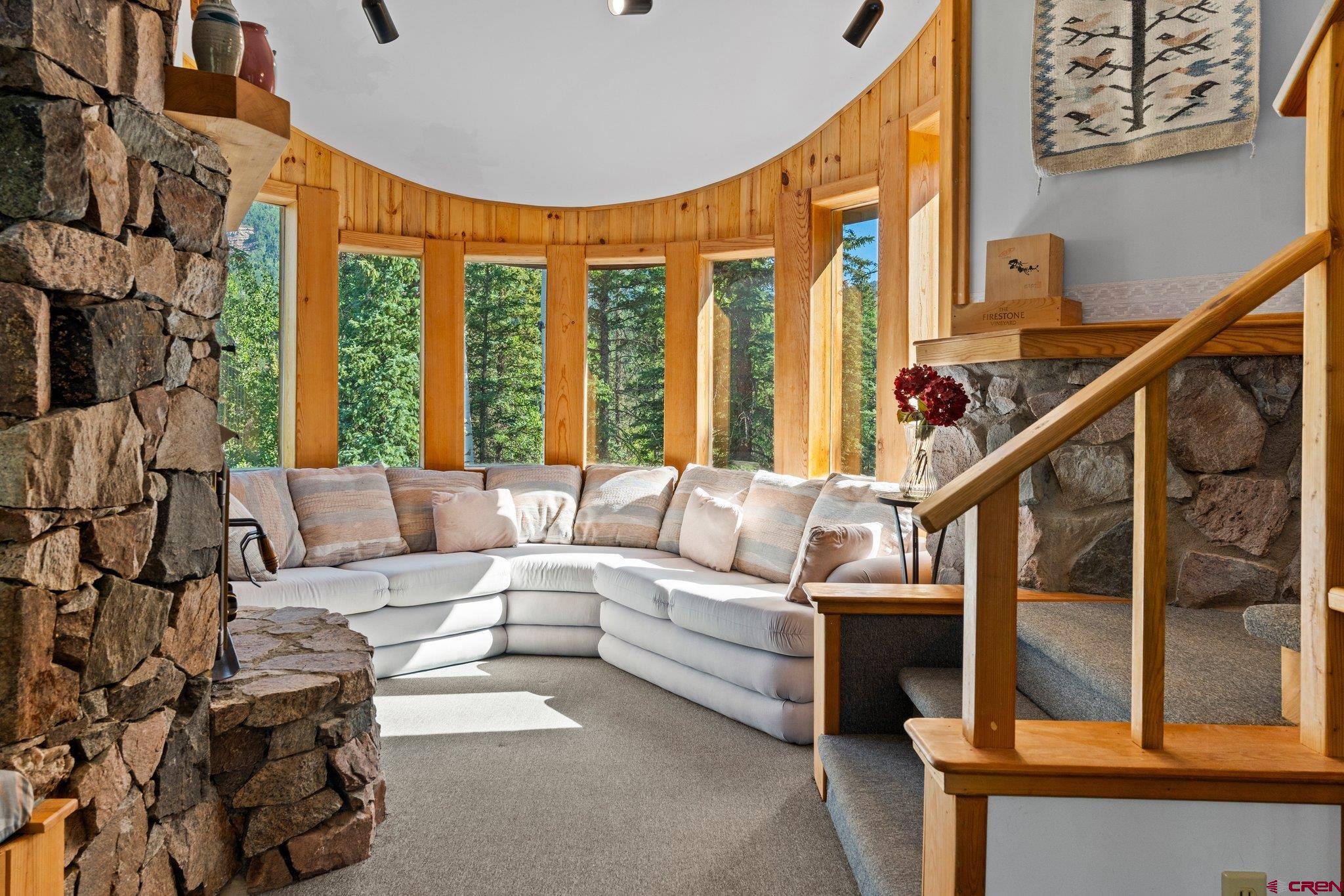 1389 County Road 240 Durango, CO 81301 - Photo 16 of 35 a living room with furniture a large window and furniture