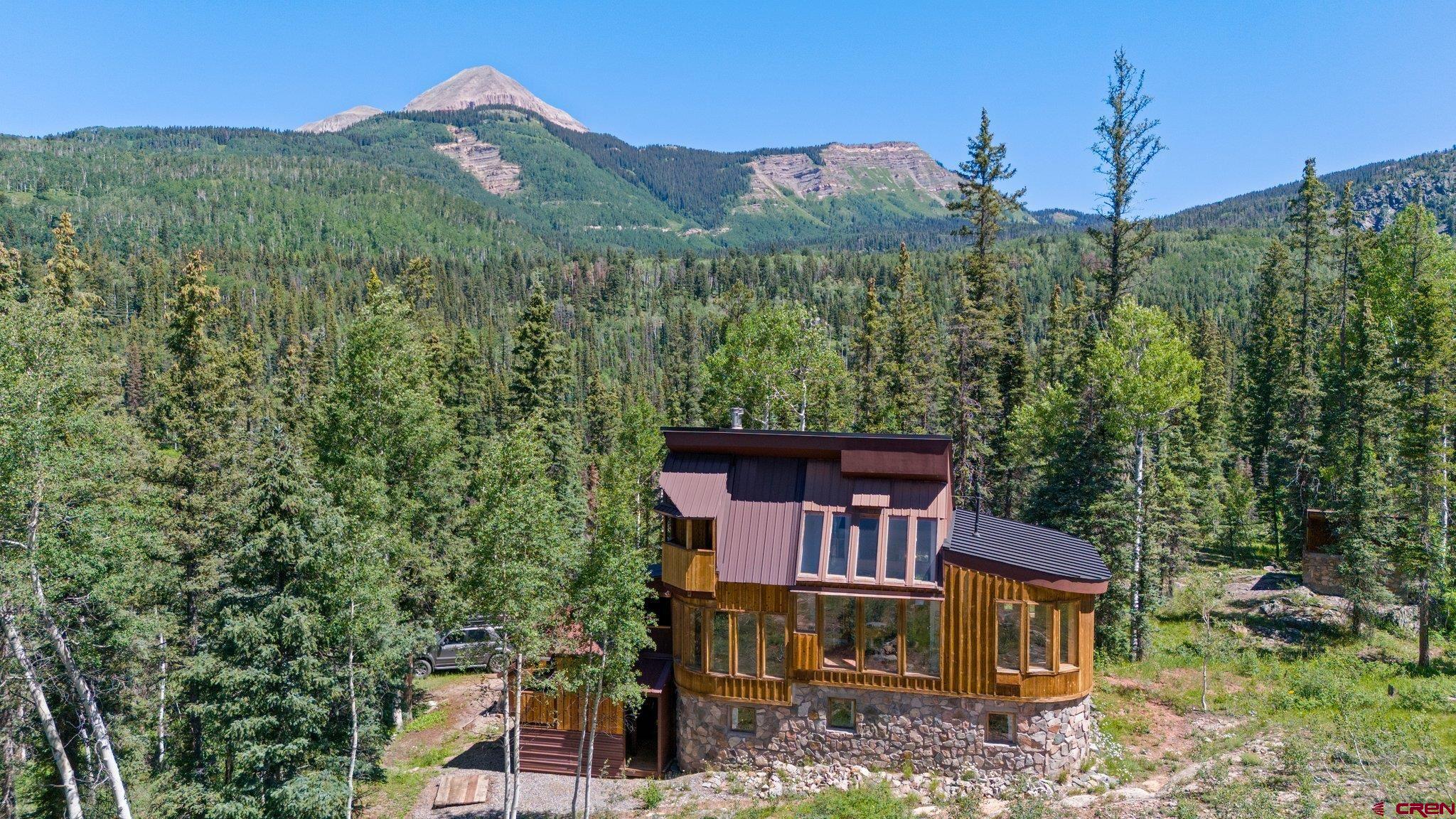1389 County Road 240 Durango, CO 81301 - Photo 2 of 35 a view of a house with a yard and mountain view