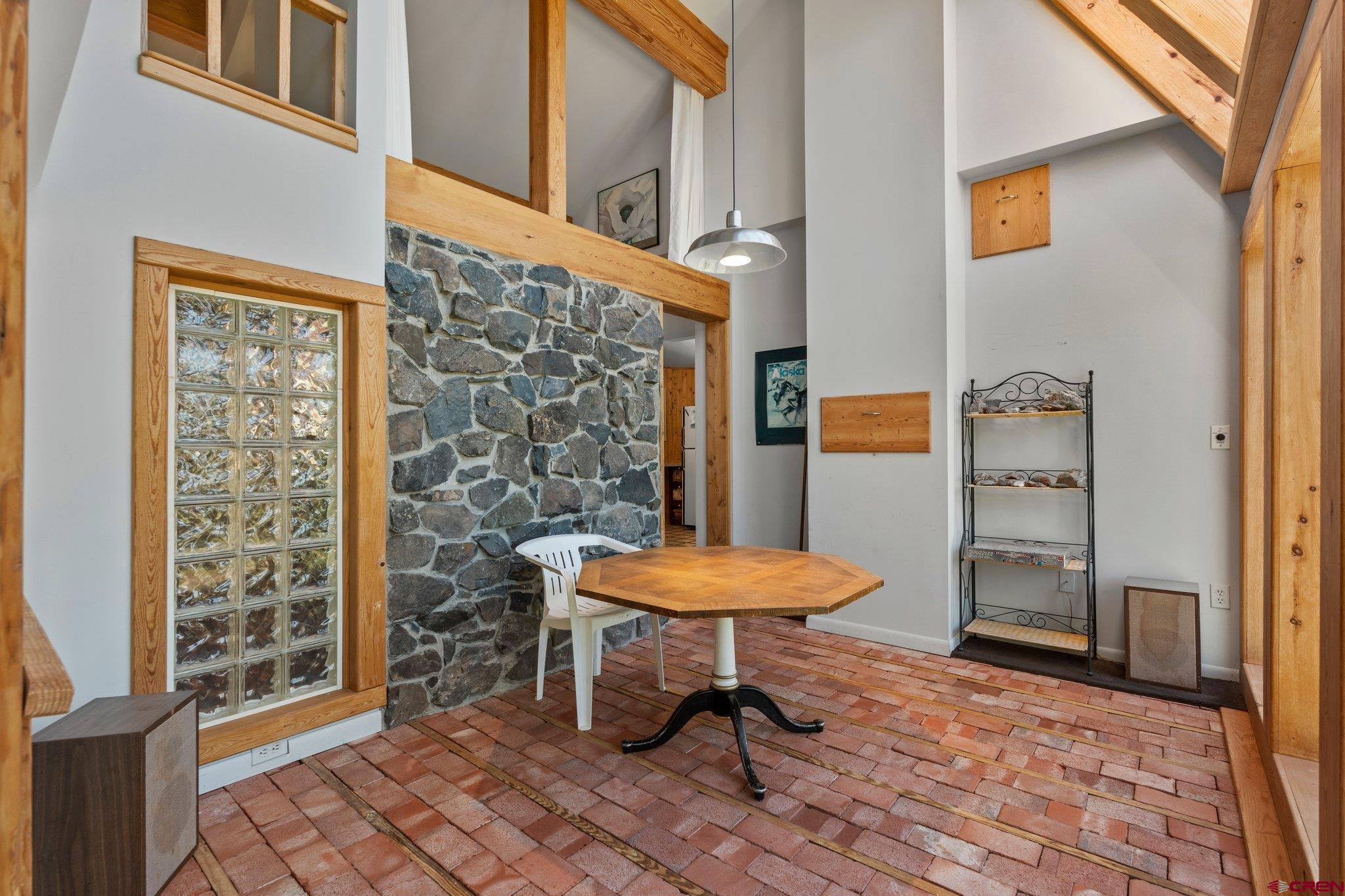 1389 County Road 240 Durango, CO 81301 - Photo 23 of 35 a view of a bedroom with a table and chairs
