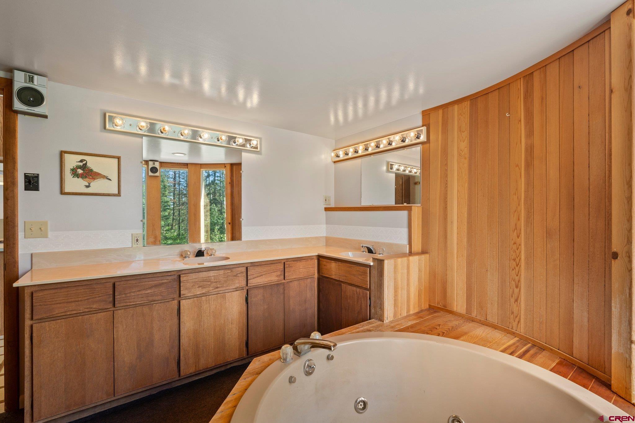 1389 County Road 240 Durango, CO 81301 - Photo 27 of 35 a en suite bathroom with a sink and mirror