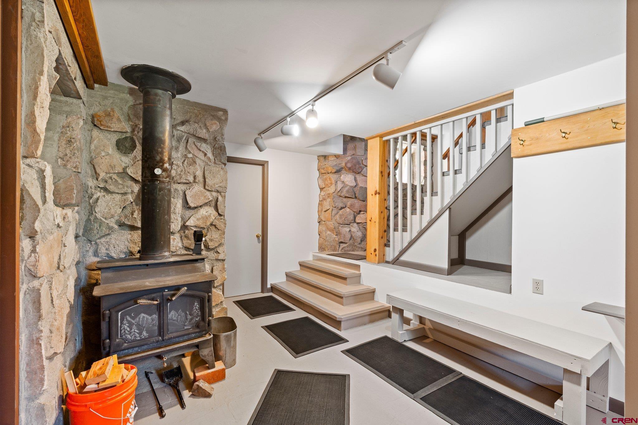 1389 County Road 240 Durango, CO 81301 - Photo 32 of 35 a living room with furniture and a fireplace
