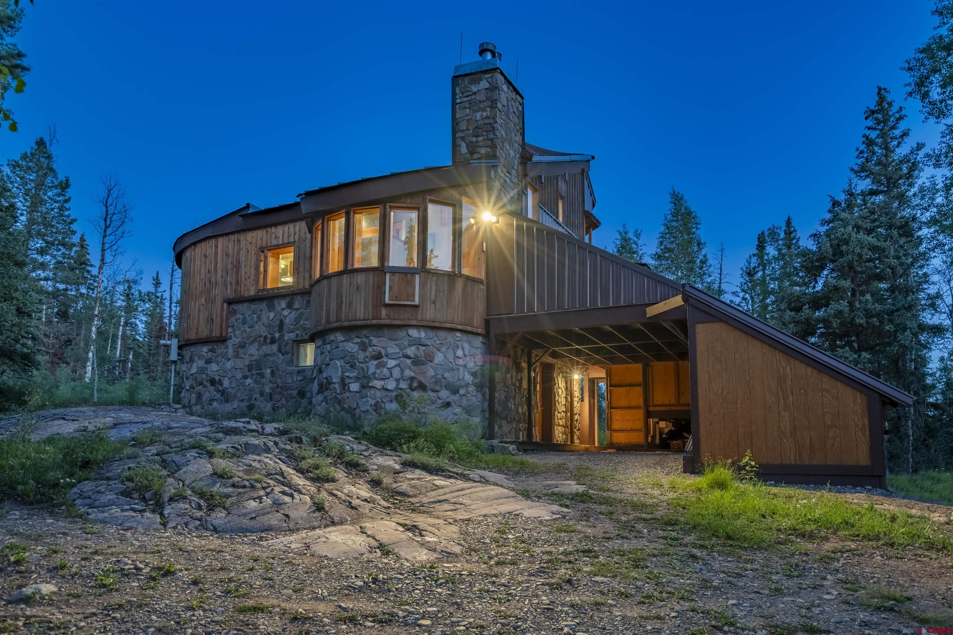 1389 County Road 240 Durango, CO 81301 - Photo 8 of 35 a front view of a house with garden