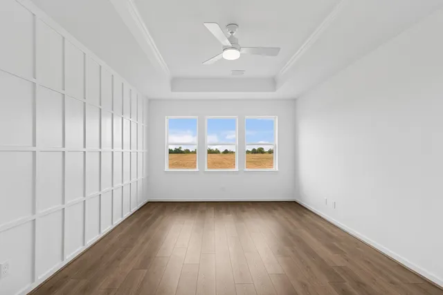 a view of a room with wooden floor