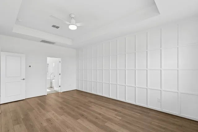 a bathroom with a double vanity sink a mirror and a bathtub