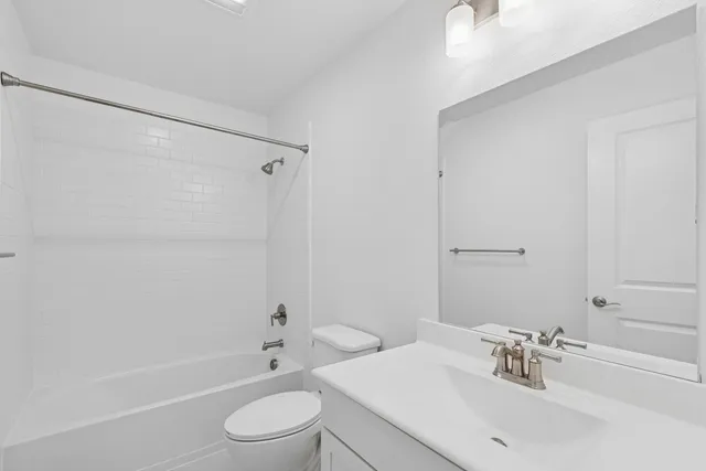 a view of an empty room and closet area