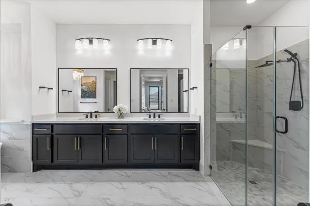a bathroom with a double vanity sink and a mirror