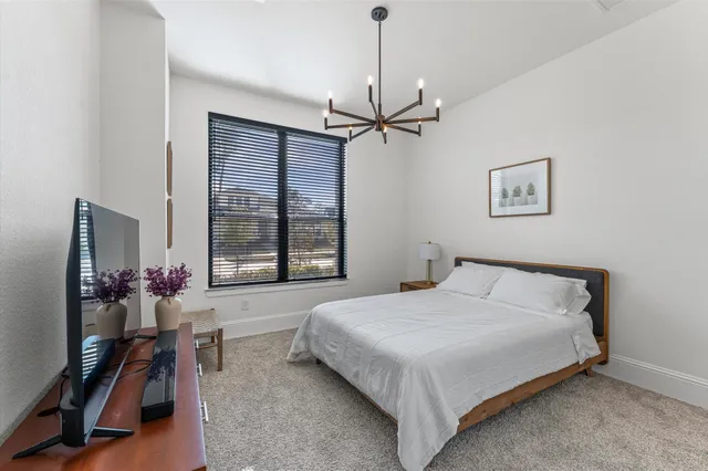 a bedroom with a bed furniture and a window