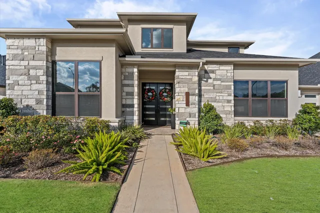 front view of a house with a yard