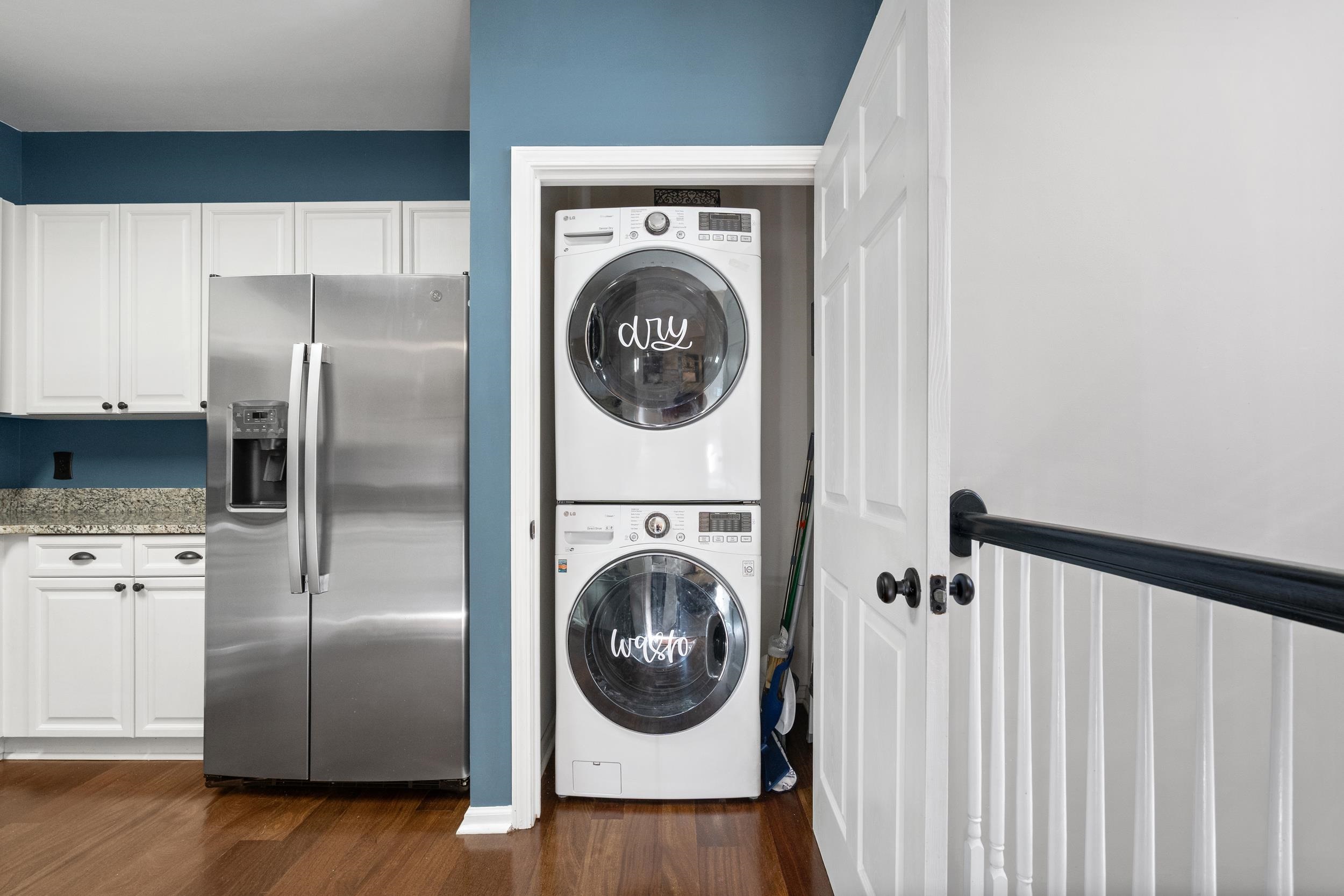 4436 Lady Banks Lane, Unit B2 Murrells Inlet, SC 29576 - Photo 13 of 36 Laundry area featuring dark wood-type flooring and estacked washer and dryer
