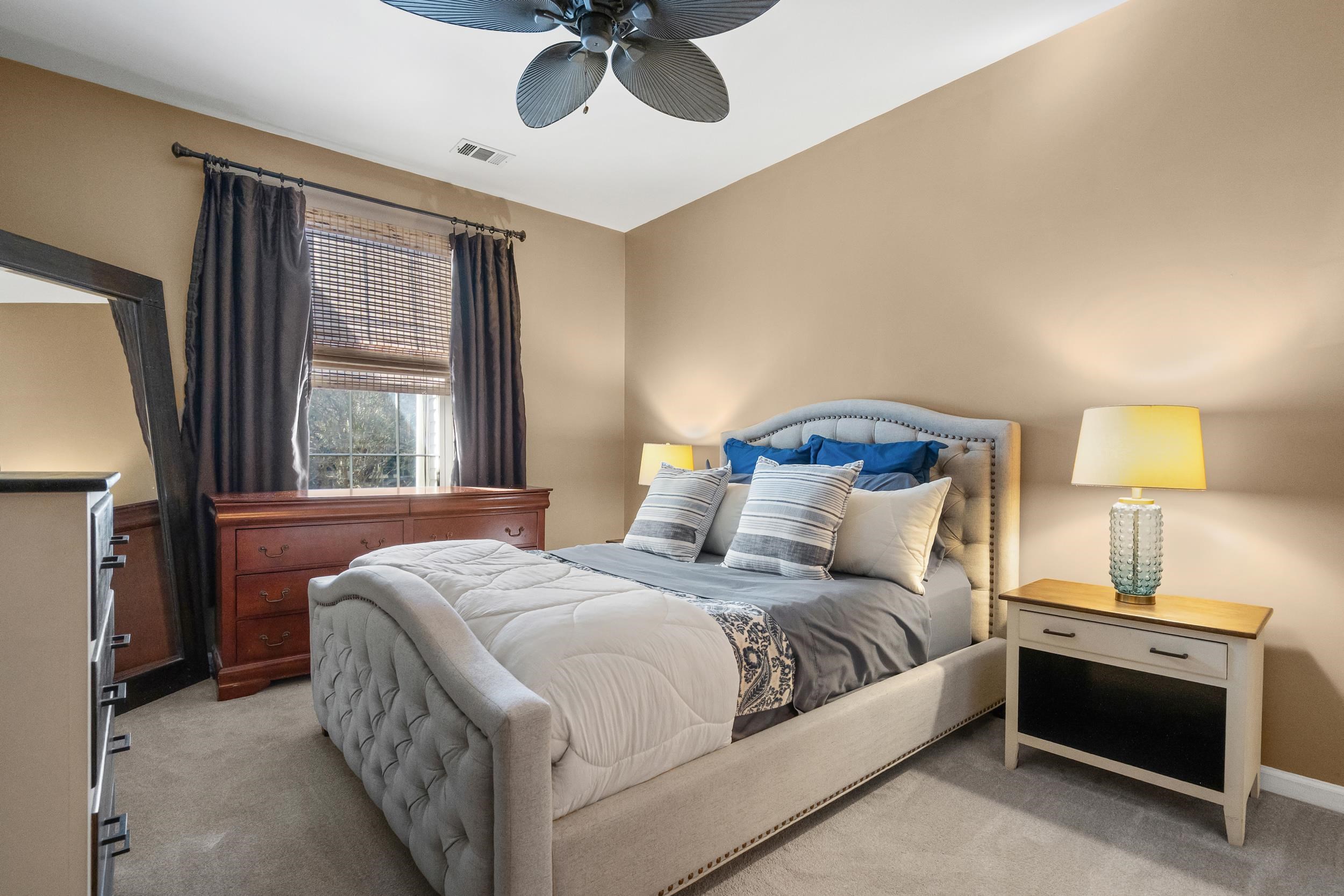 4436 Lady Banks Lane, Unit B2 Murrells Inlet, SC 29576 - Photo 14 of 36 Bedroom with light colored carpet and a ceiling fan