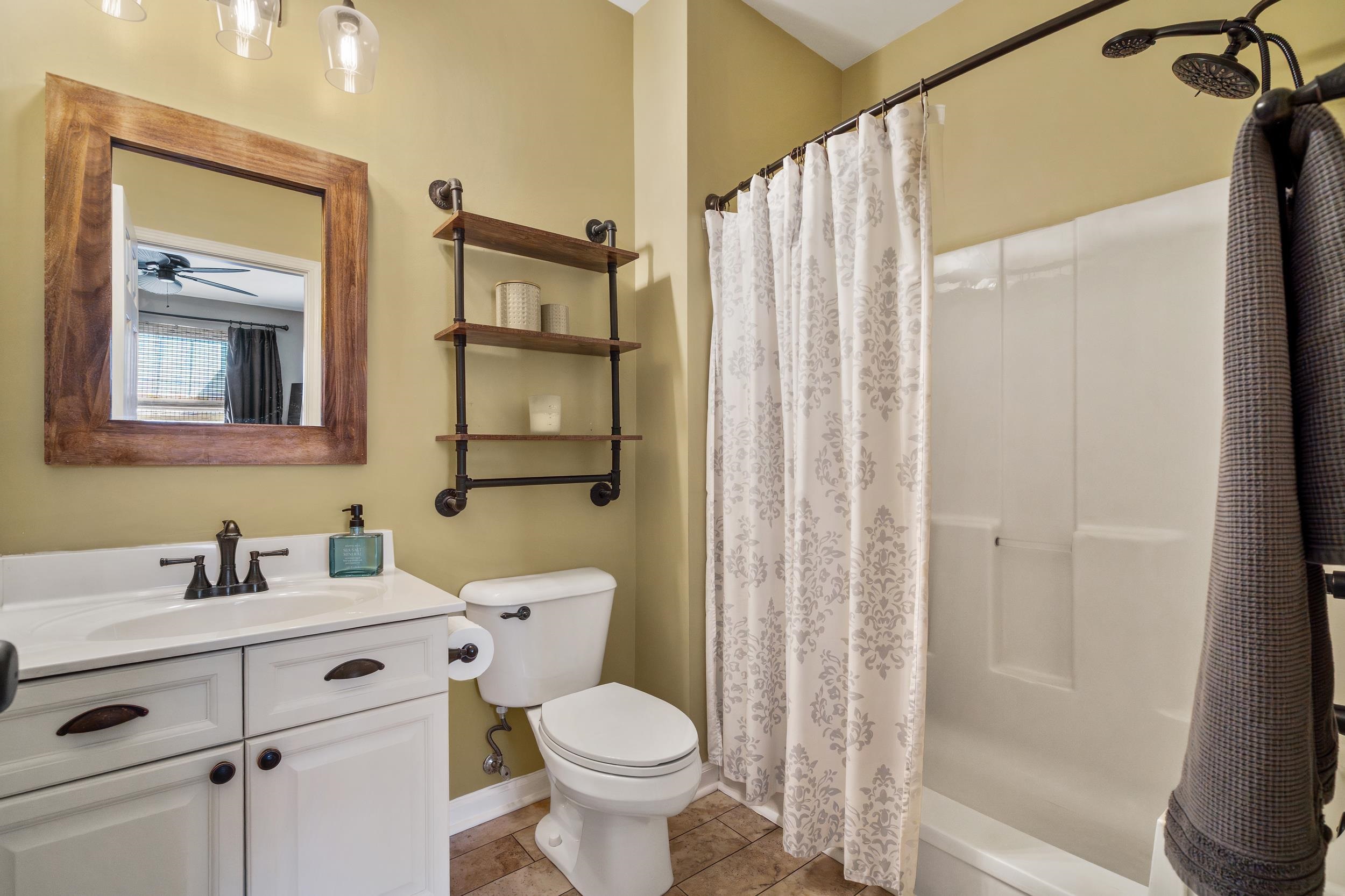 4436 Lady Banks Lane, Unit B2 Murrells Inlet, SC 29576 - Photo 16 of 36 Bathroom with vanity, light tile patterned flooring, ceiling fan, and shower / bath combo
