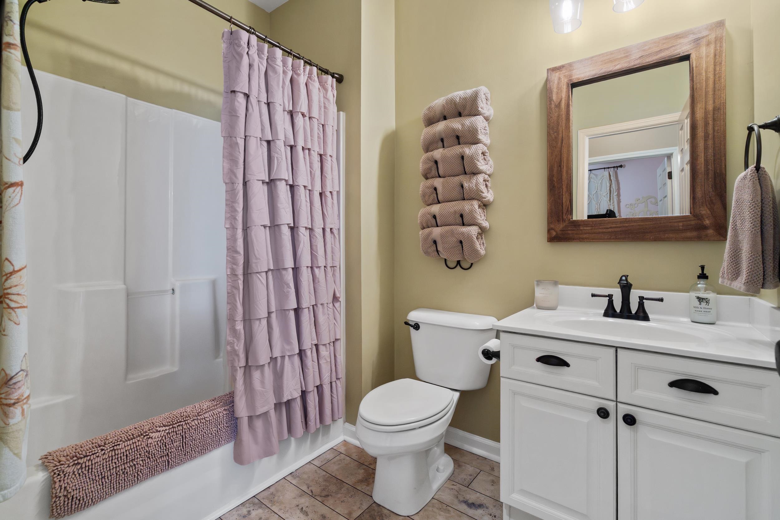 4436 Lady Banks Lane, Unit B2 Murrells Inlet, SC 29576 - Photo 18 of 36 Bathroom with shower / bathtub combination with curtain, vanity, and light tile patterned flooring