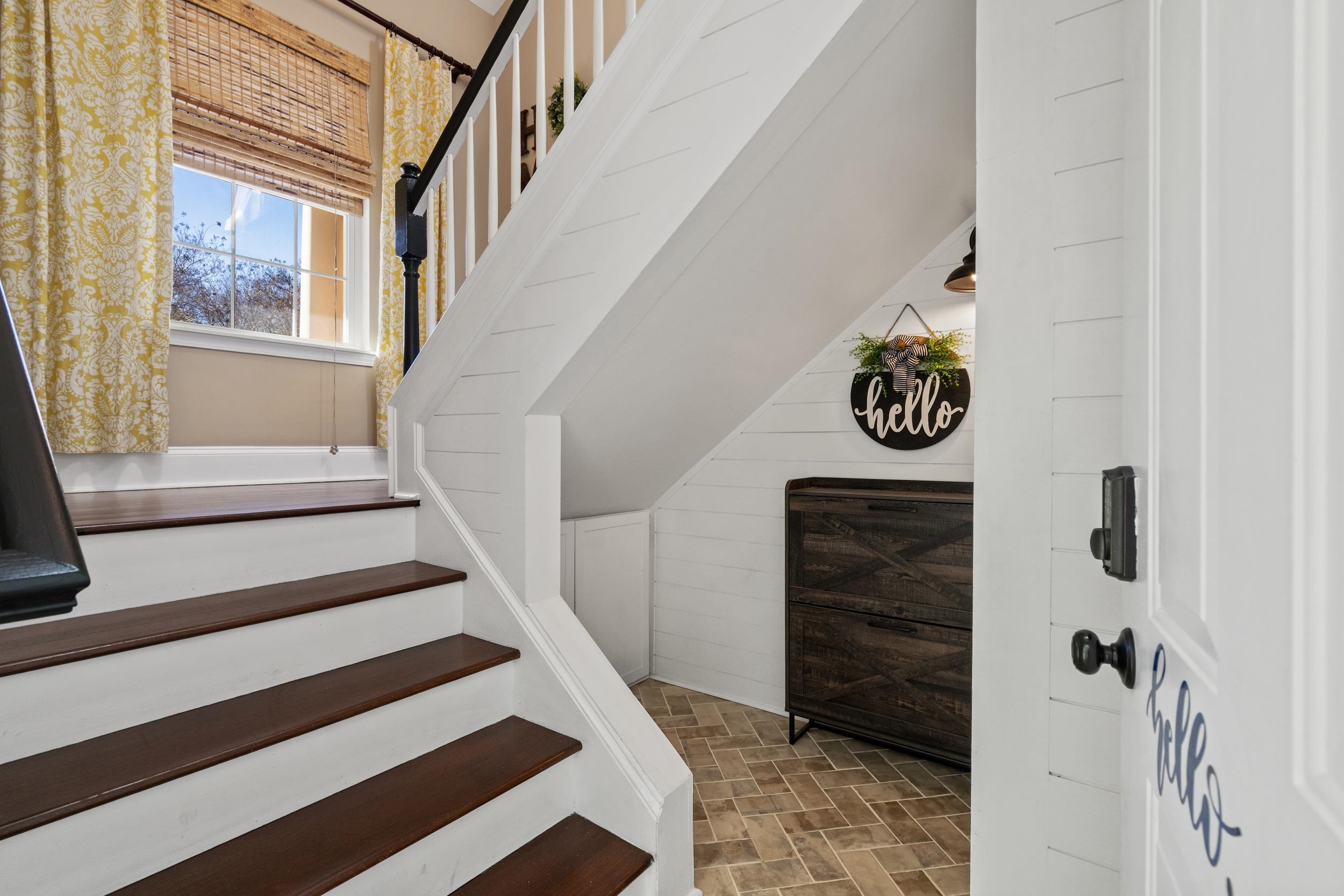 4436 Lady Banks Lane, Unit B2 Murrells Inlet, SC 29576 - Photo 2 of 36 Staircase featuring brick patterned flooring and wooden walls