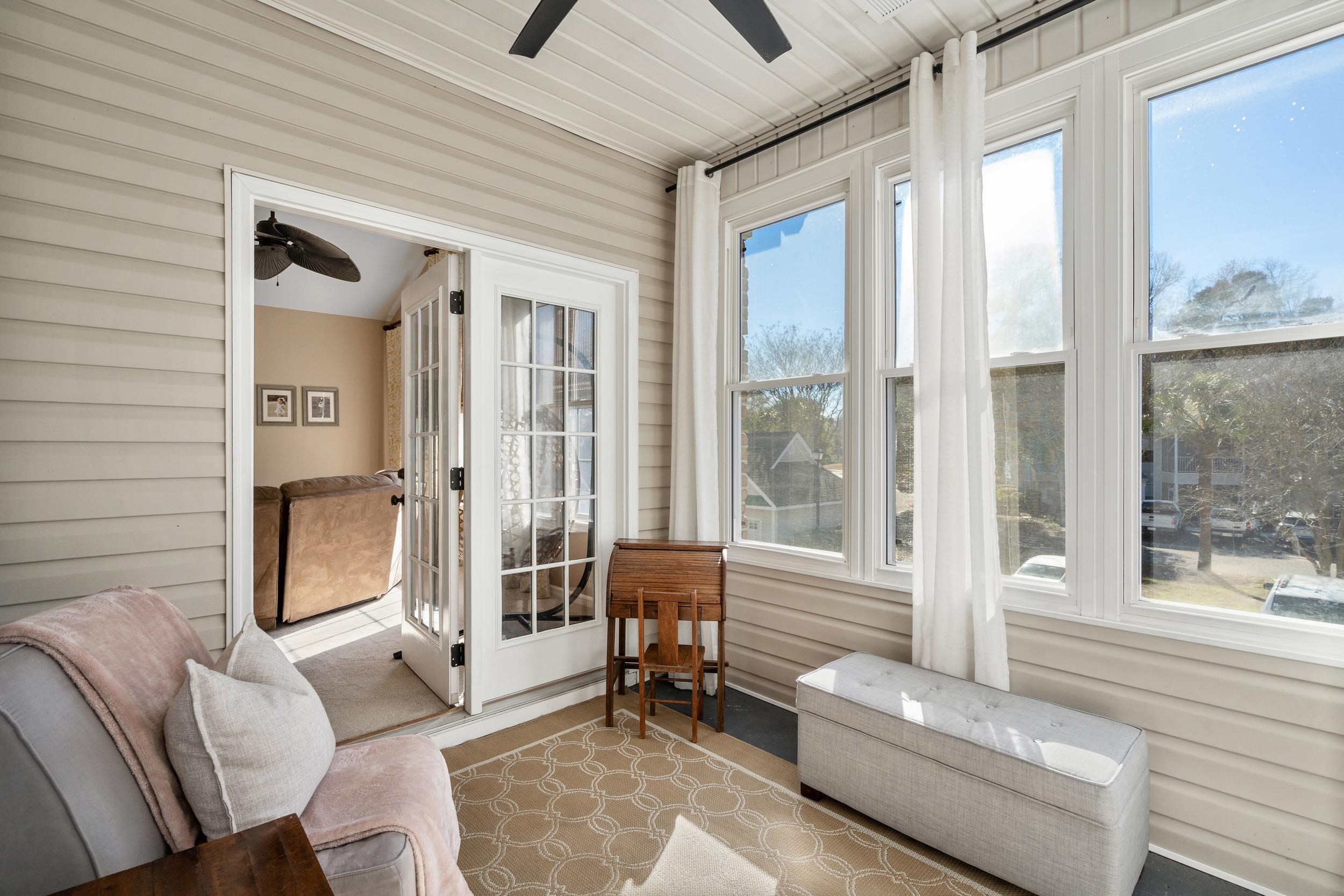4436 Lady Banks Lane, Unit B2 Murrells Inlet, SC 29576 - Photo 21 of 36 Sunroom with ceiling fan and wooden walls
