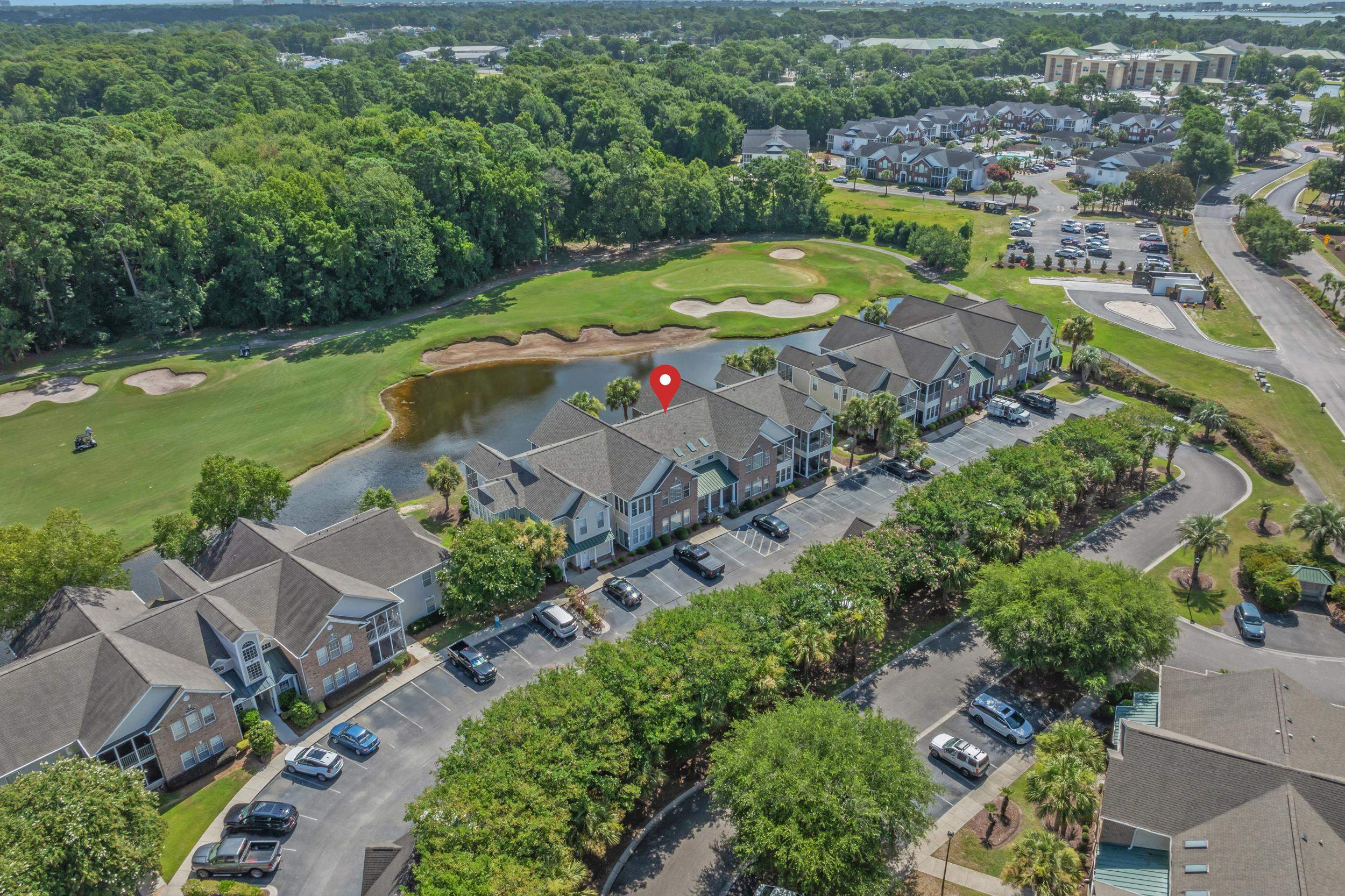 4436 Lady Banks Lane, Unit B2 Murrells Inlet, SC 29576 - Photo 26 of 36 Aerial view of property's location with a golf club and a nearby body of water