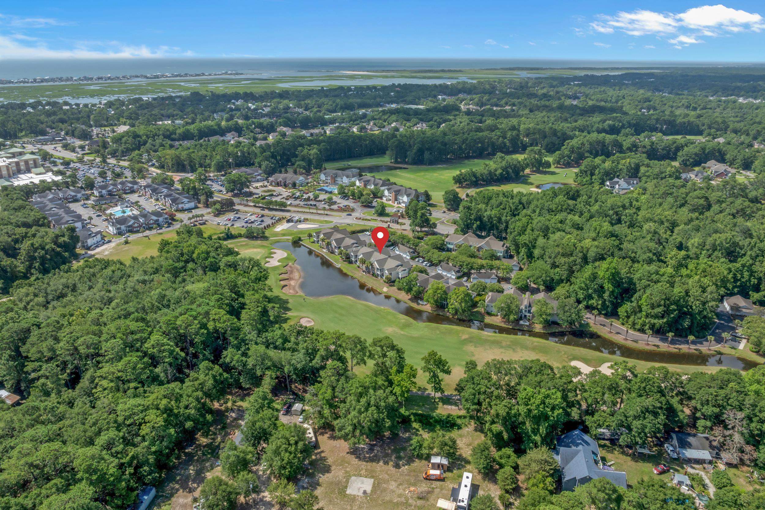 4436 Lady Banks Lane, Unit B2 Murrells Inlet, SC 29576 - Photo 36 of 36 Aerial overview of property's location with a nearby body of water and nearby suburban area