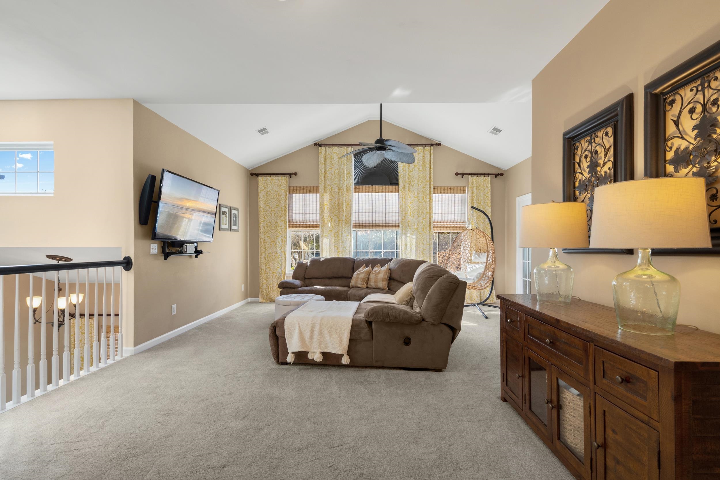 4436 Lady Banks Lane, Unit B2 Murrells Inlet, SC 29576 - Photo 5 of 36 Living room featuring vaulted ceiling, light carpet, and ceiling fan