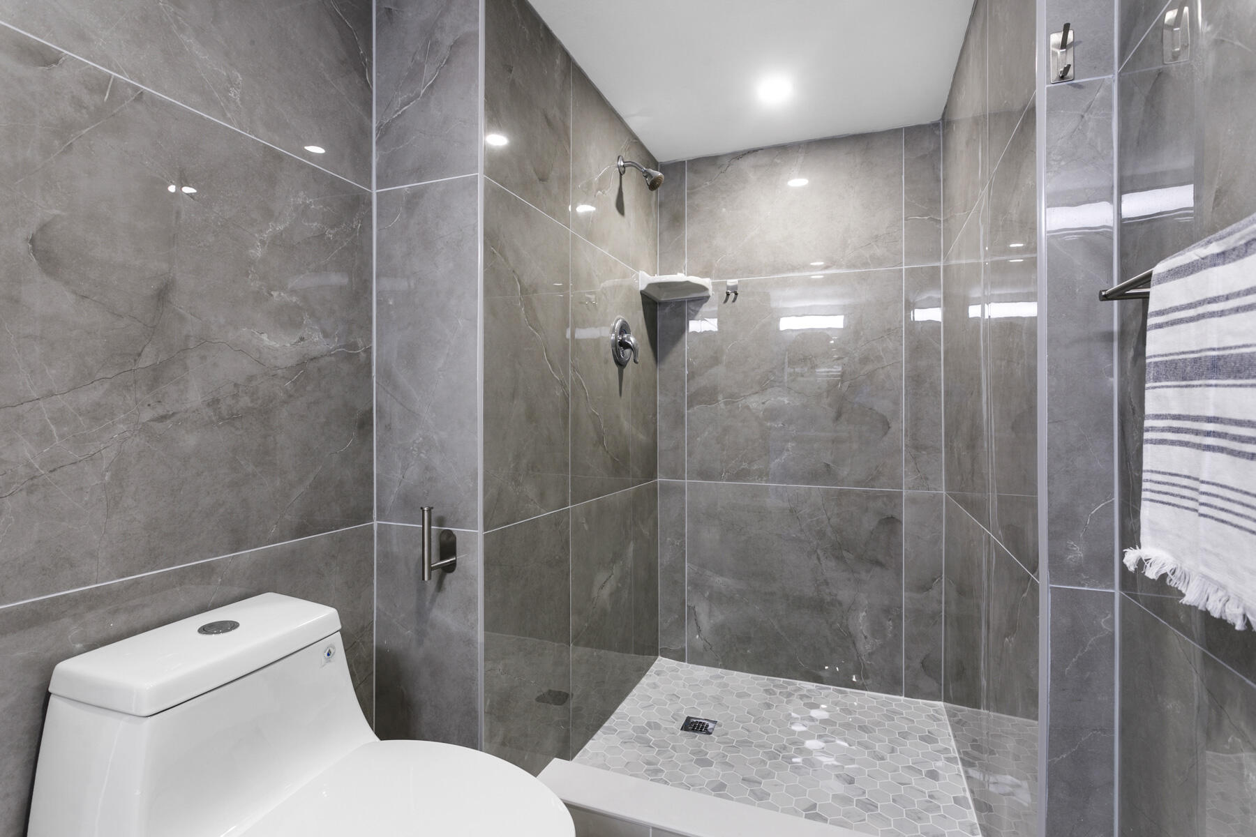 1200 Marine Way, Unit 802 North Palm Beach, FL 33408 - Photo 17 of 34 a bathroom with a toilet and a shower