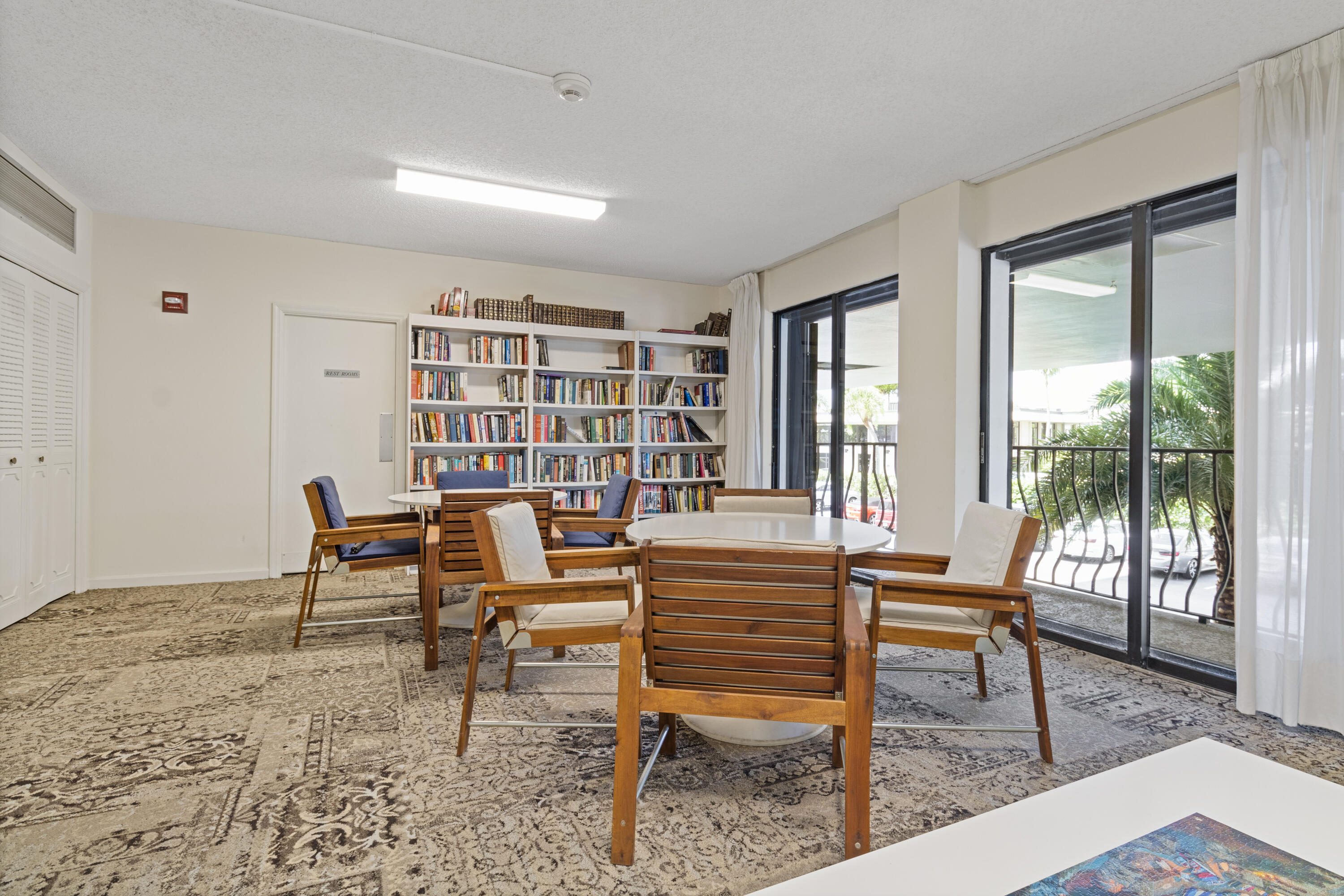 1200 Marine Way, Unit 802 North Palm Beach, FL 33408 - Photo 23 of 34 a living room with furniture and a floor to ceiling window