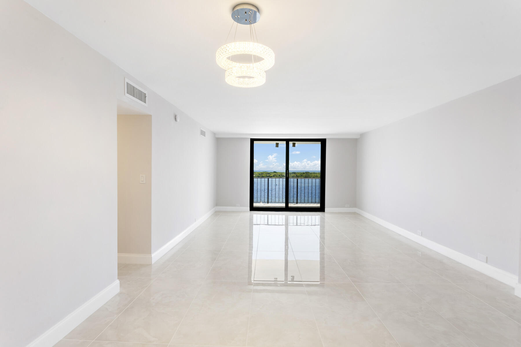 1200 Marine Way, Unit 802 North Palm Beach, FL 33408 - Photo 10 of 34 an empty room with windows and entrance