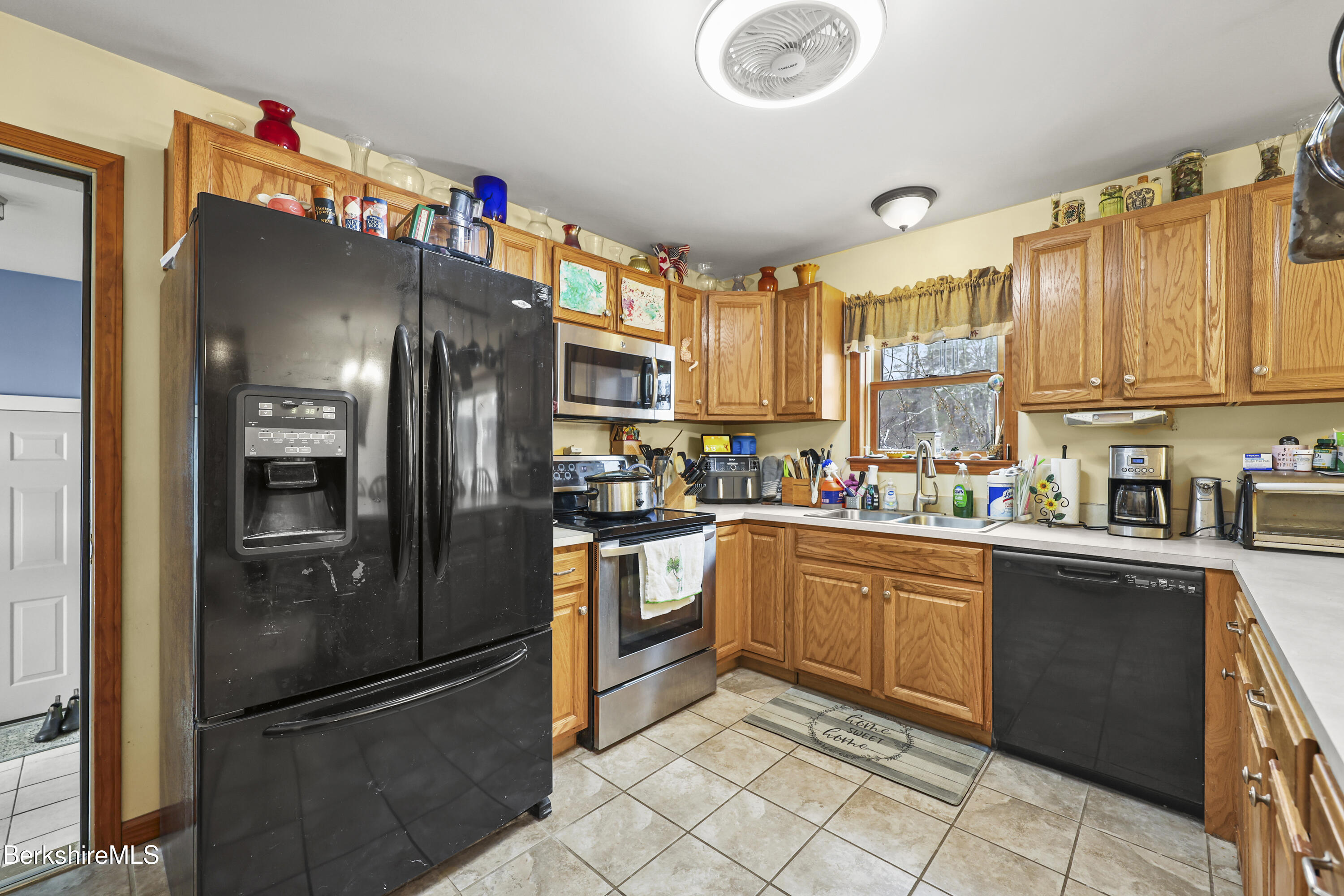 121 W Road Lee, MA 01238 - Photo 15 of 48 a kitchen with granite countertop stainless steel appliances and refrigerator
