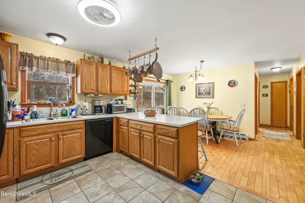 a large kitchen with lots of table and chairs