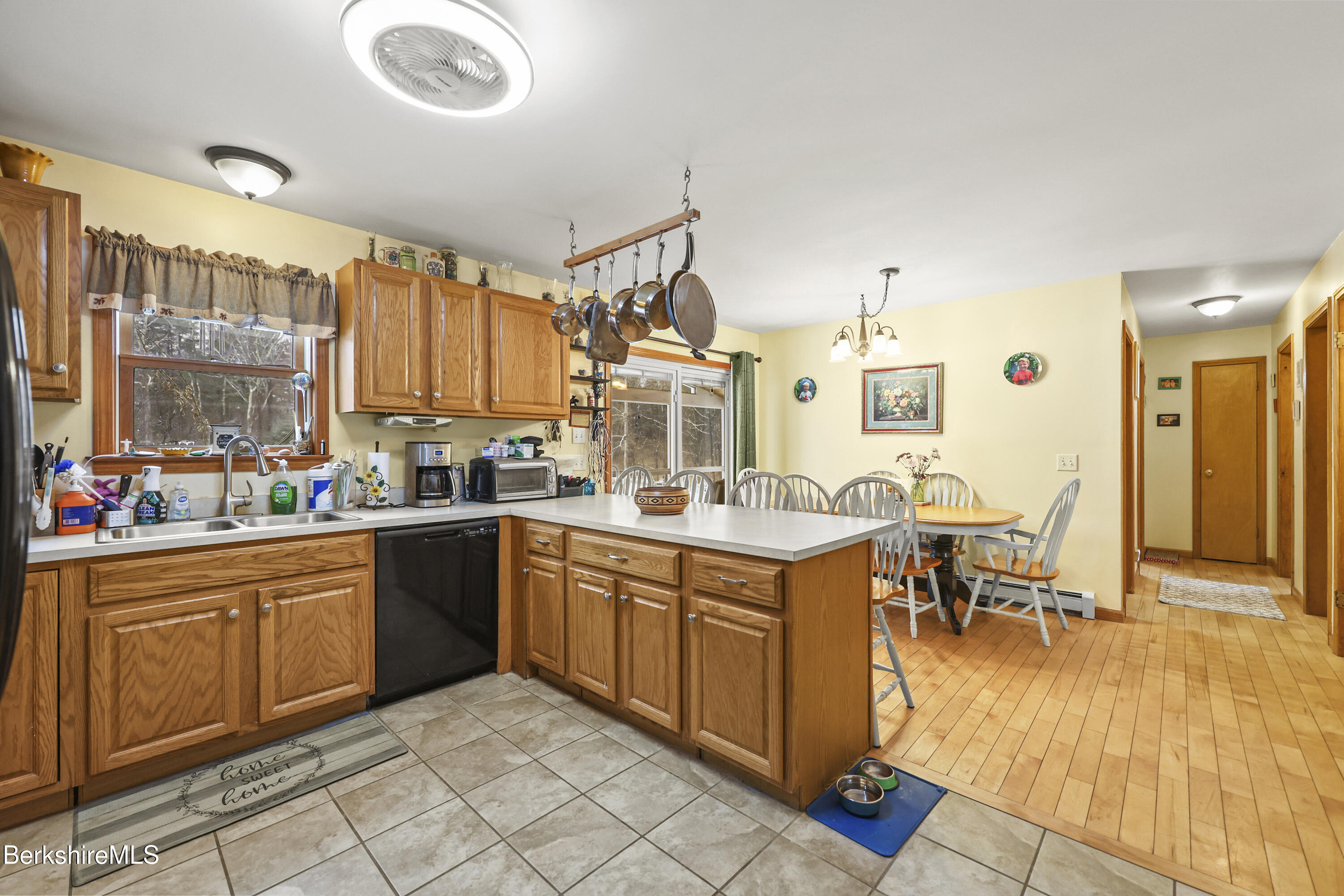 121 W Road Lee, MA 01238 - Photo 17 of 48 a large kitchen with lots of table and chairs