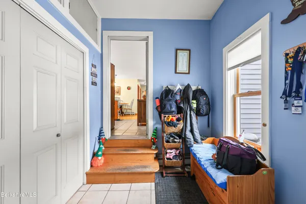 a bedroom with furniture and a window