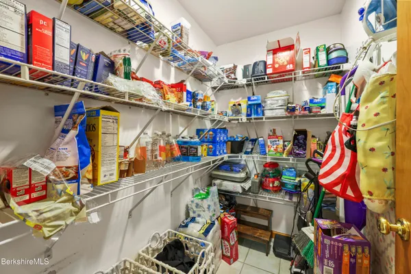 a store room with lots of storage and a utility