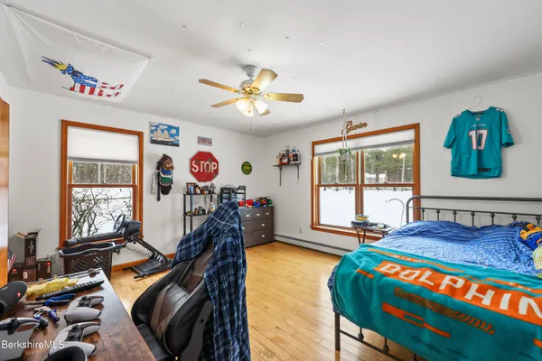 a bedroom with furniture and a window