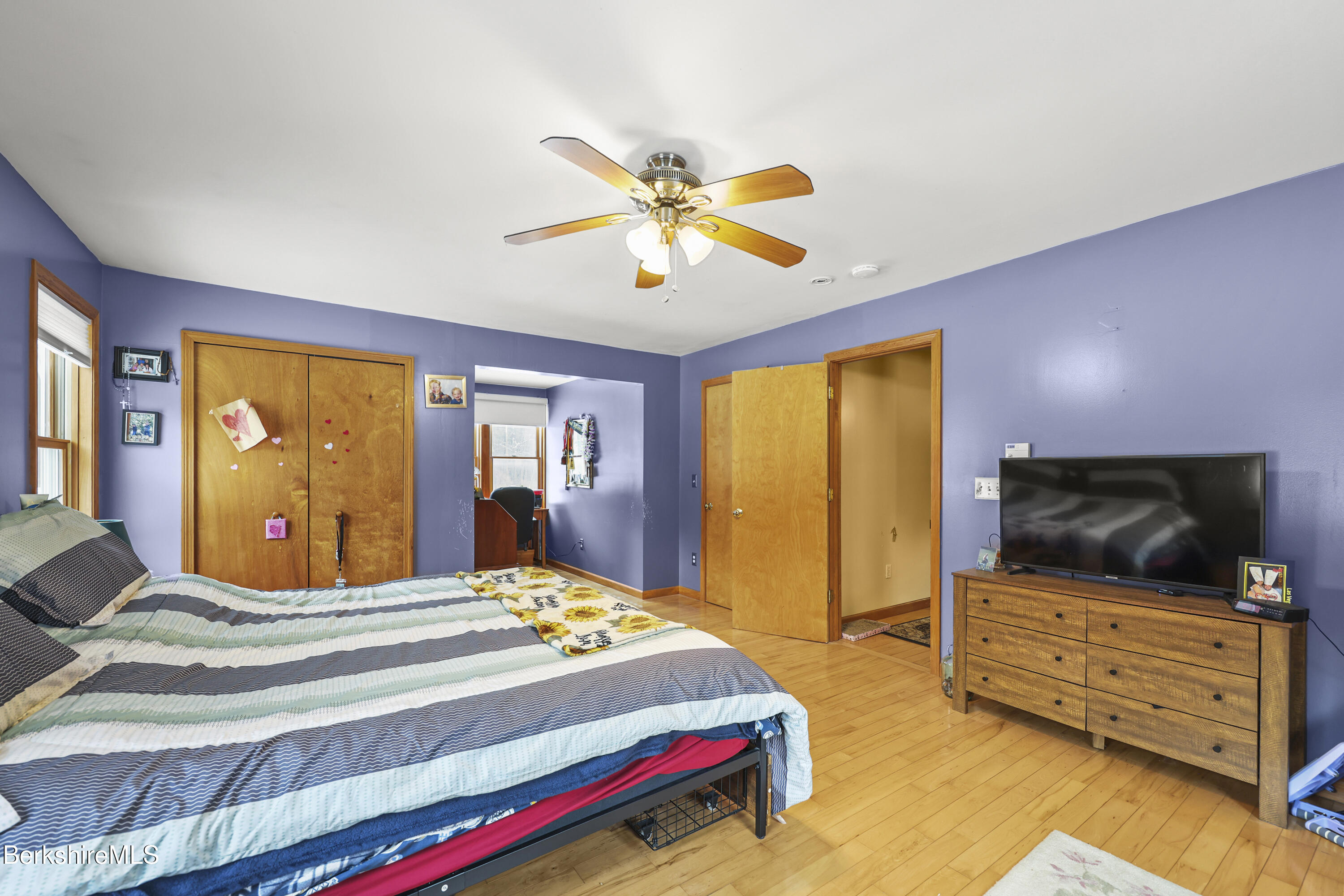121 W Road Lee, MA 01238 - Photo 33 of 48 a bedroom with a bed and a flat screen tv