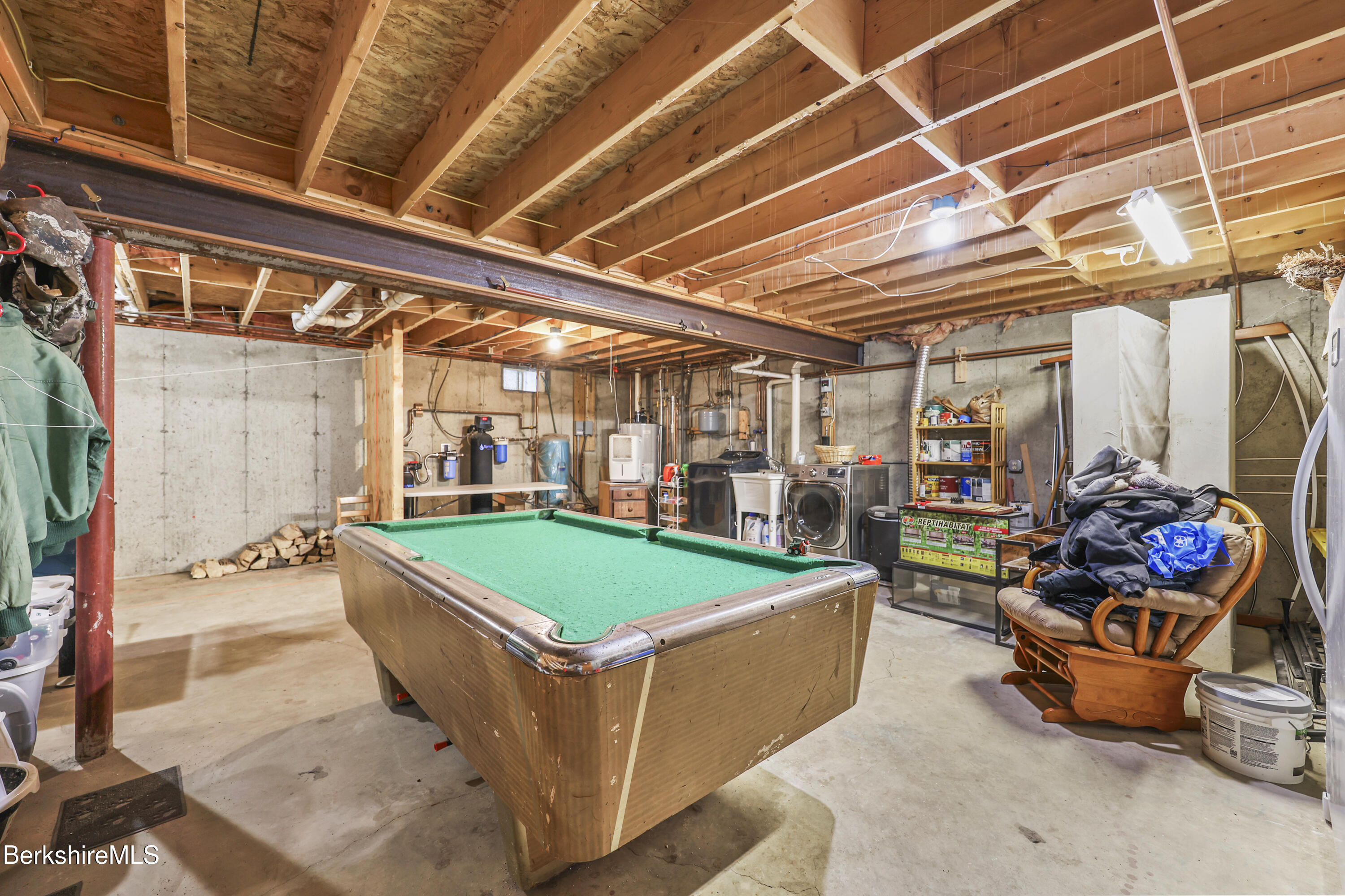 121 W Road Lee, MA 01238 - Photo 36 of 48 a room with lots of furniture and clutter