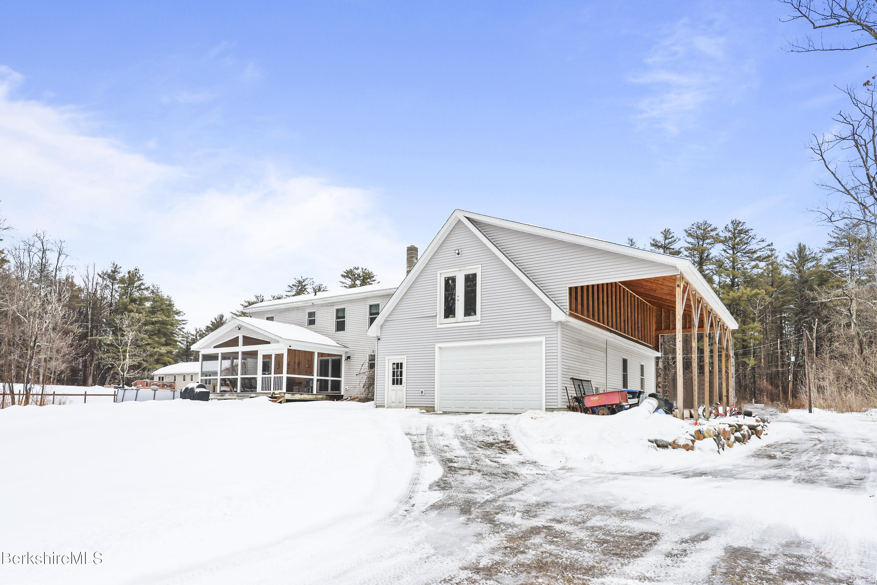 121 W Road Lee, MA 01238 - Photo 4 of 48 a view of a white house with a yard