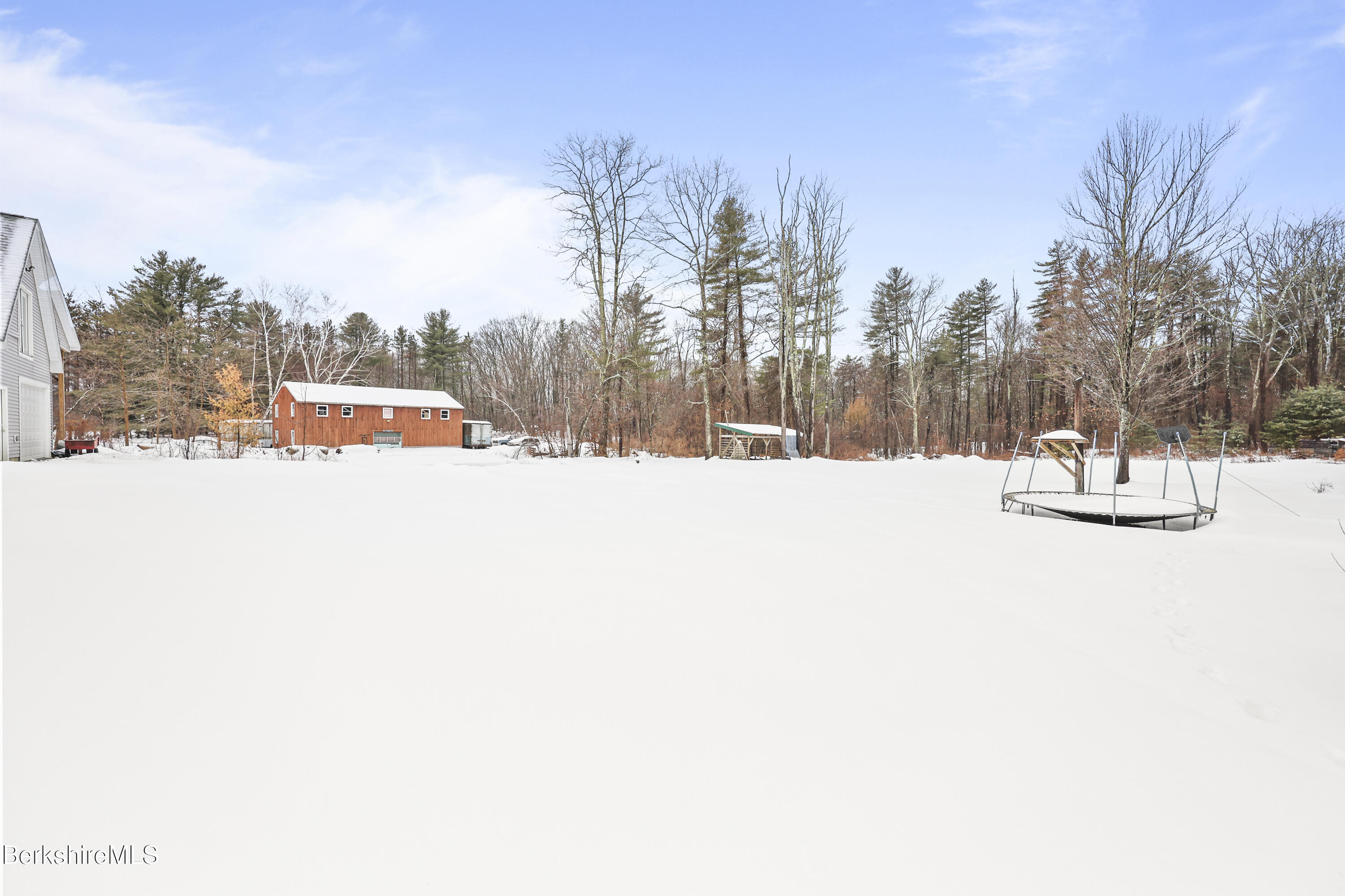 121 W Road Lee, MA 01238 - Photo 43 of 48 a view of a snow with trees in the background