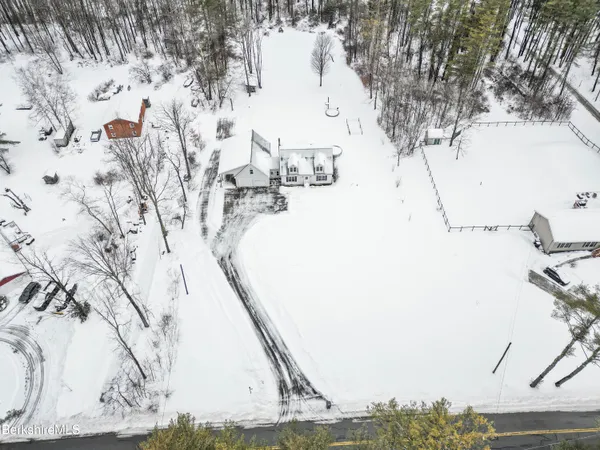 a backyard of a house with large trees