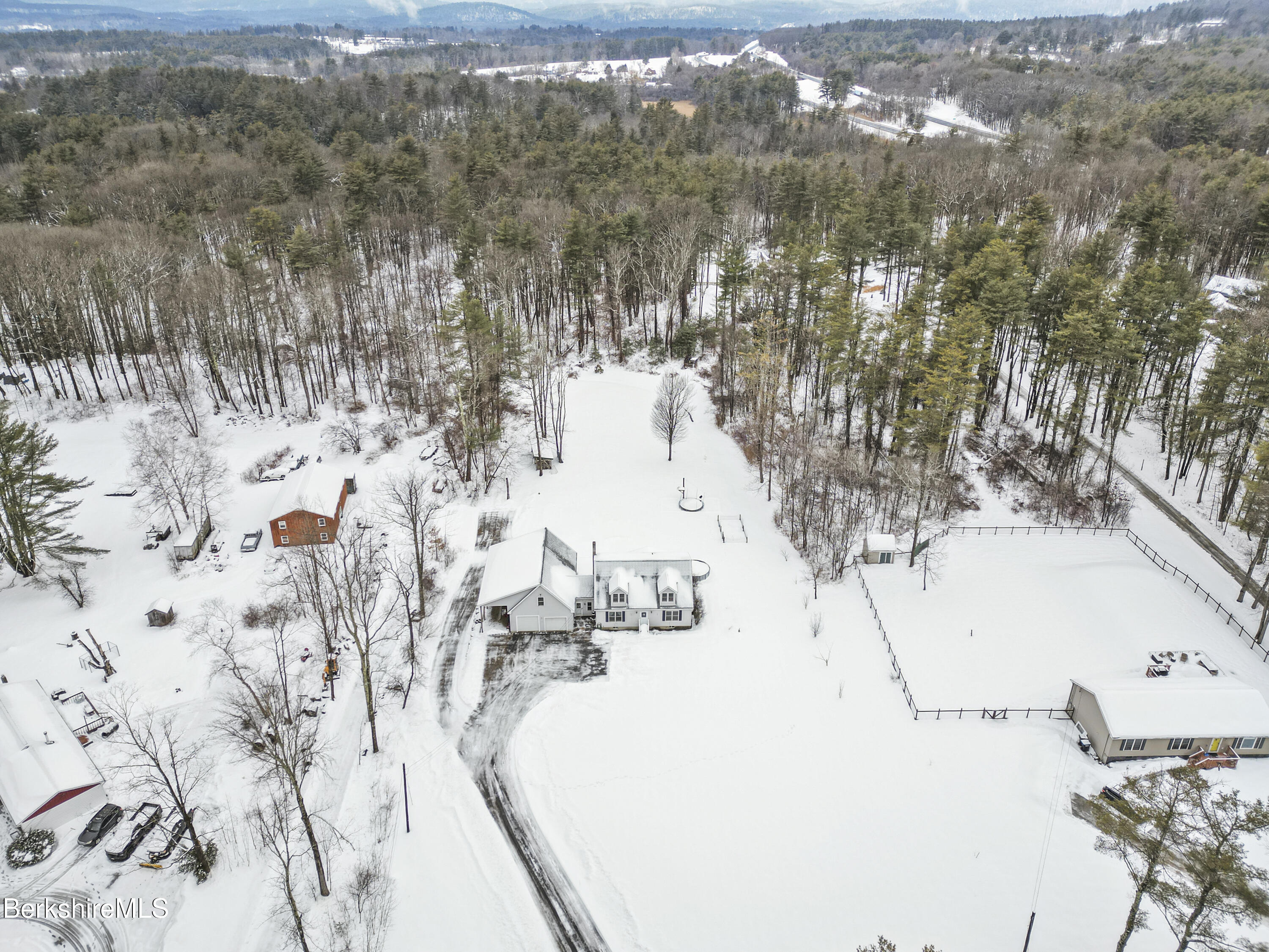 121 W Road Lee, MA 01238 - Photo 47 of 48 a view of white house with a yard covered with snow