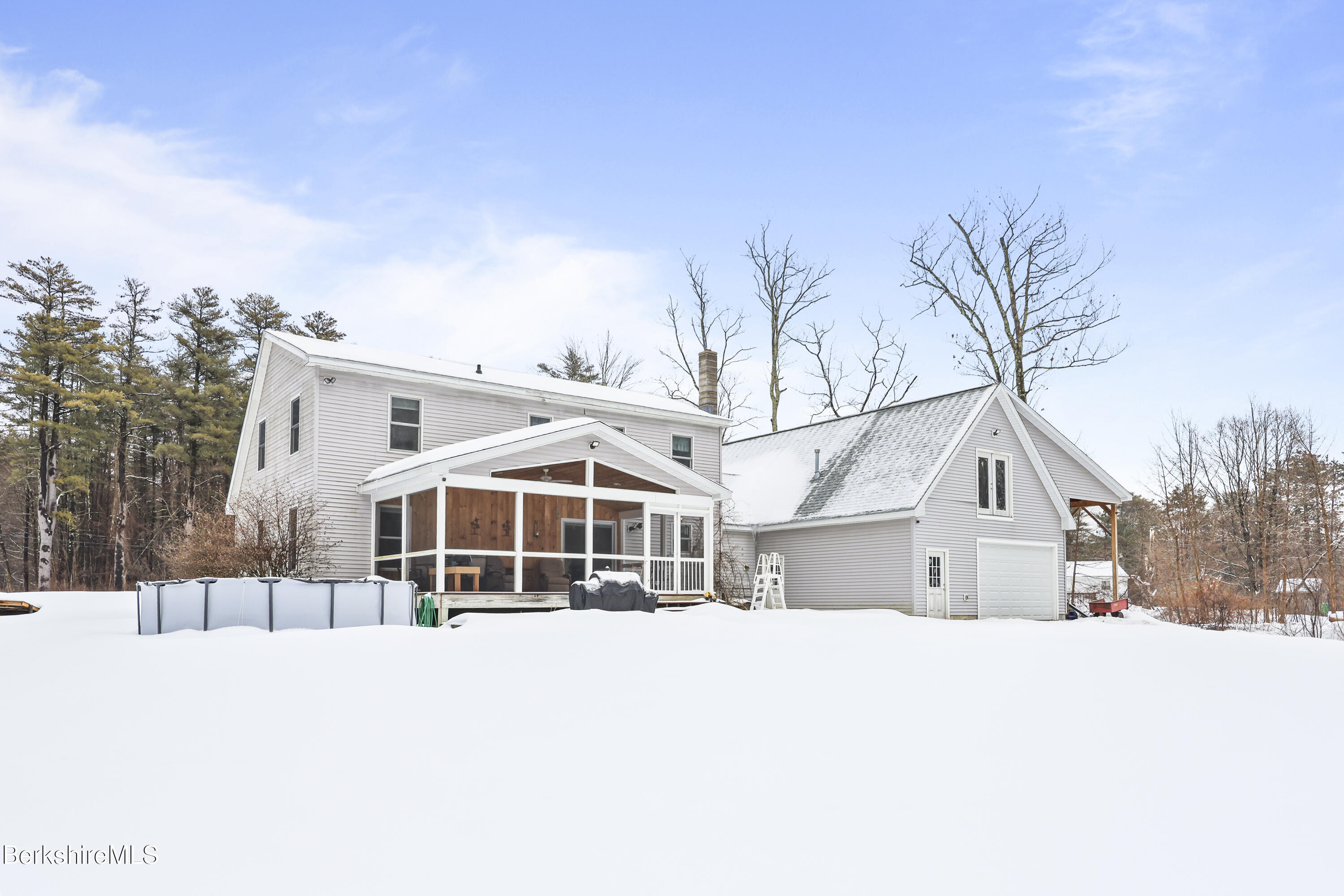 121 W Road Lee, MA 01238 - Photo 5 of 48 a house with trees in front of it