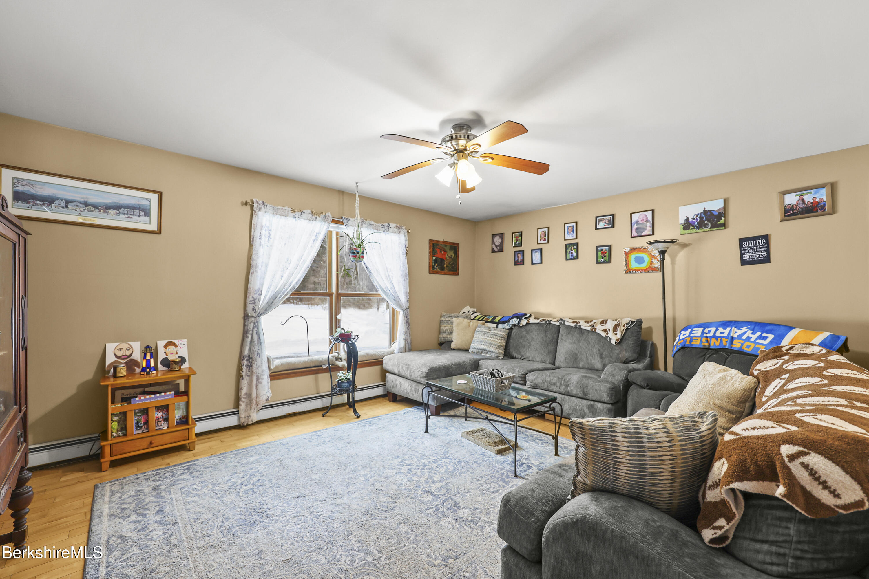 121 W Road Lee, MA 01238 - Photo 8 of 48 a living room with furniture and a flat screen tv