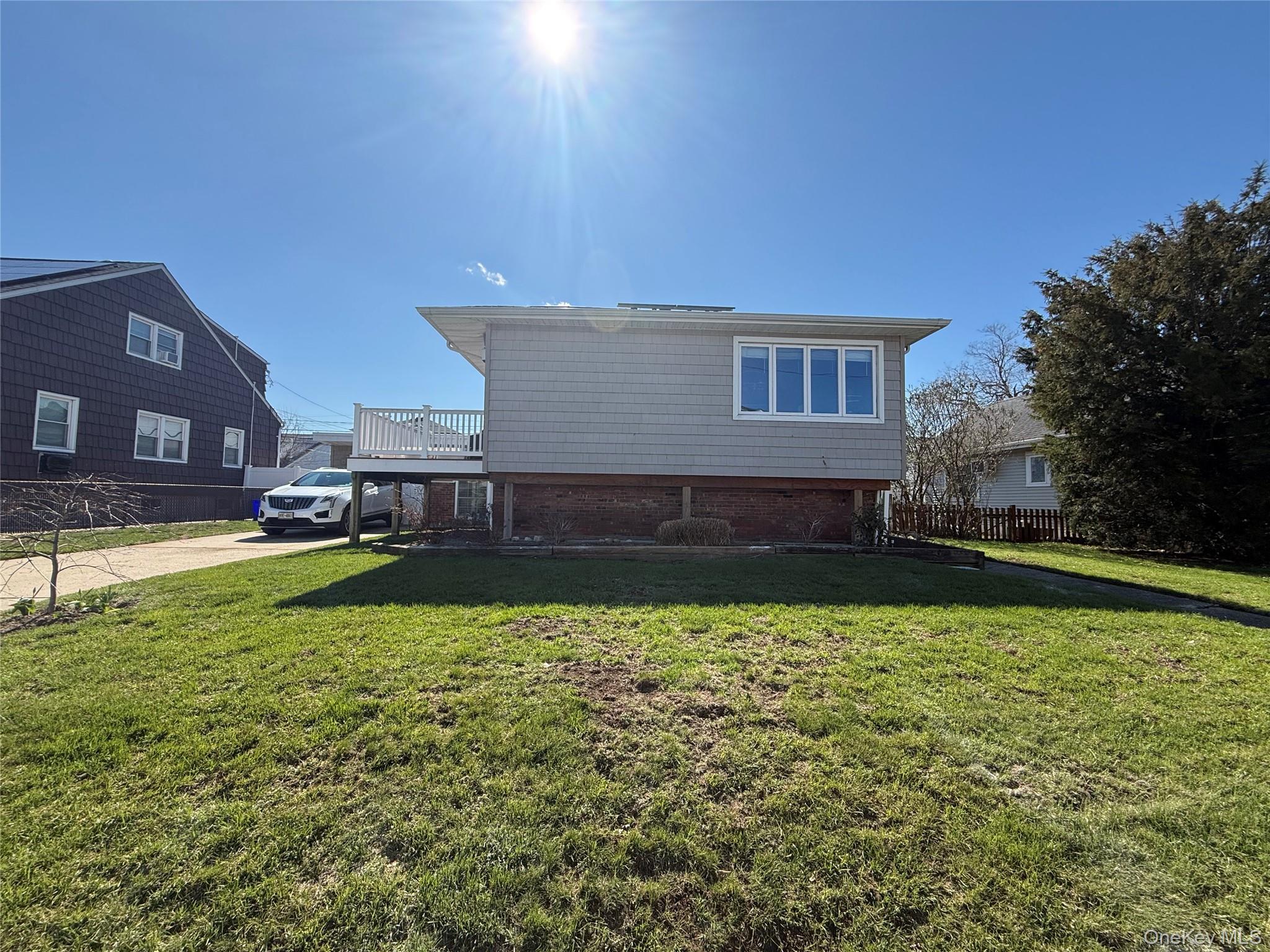 73 Waterford Road, Unit LOWER LEVEL Island Park, NY 11558 - Photo 1 of 1 a view of a house with swimming pool