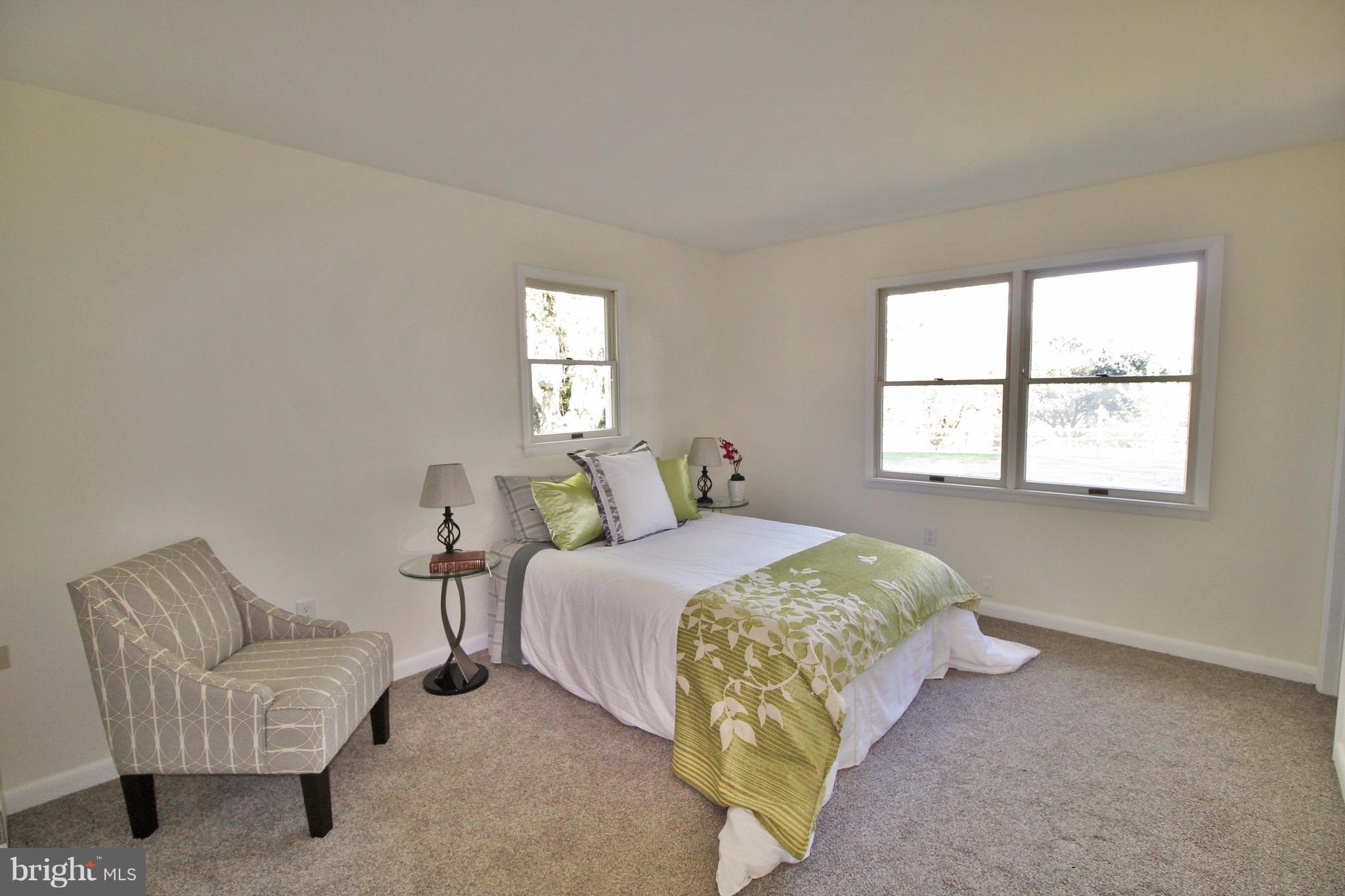 12805 Bunker Hill Road Union Bridge, MD 21791 - Photo 17 of 30 a bedroom with a bed and a couch
