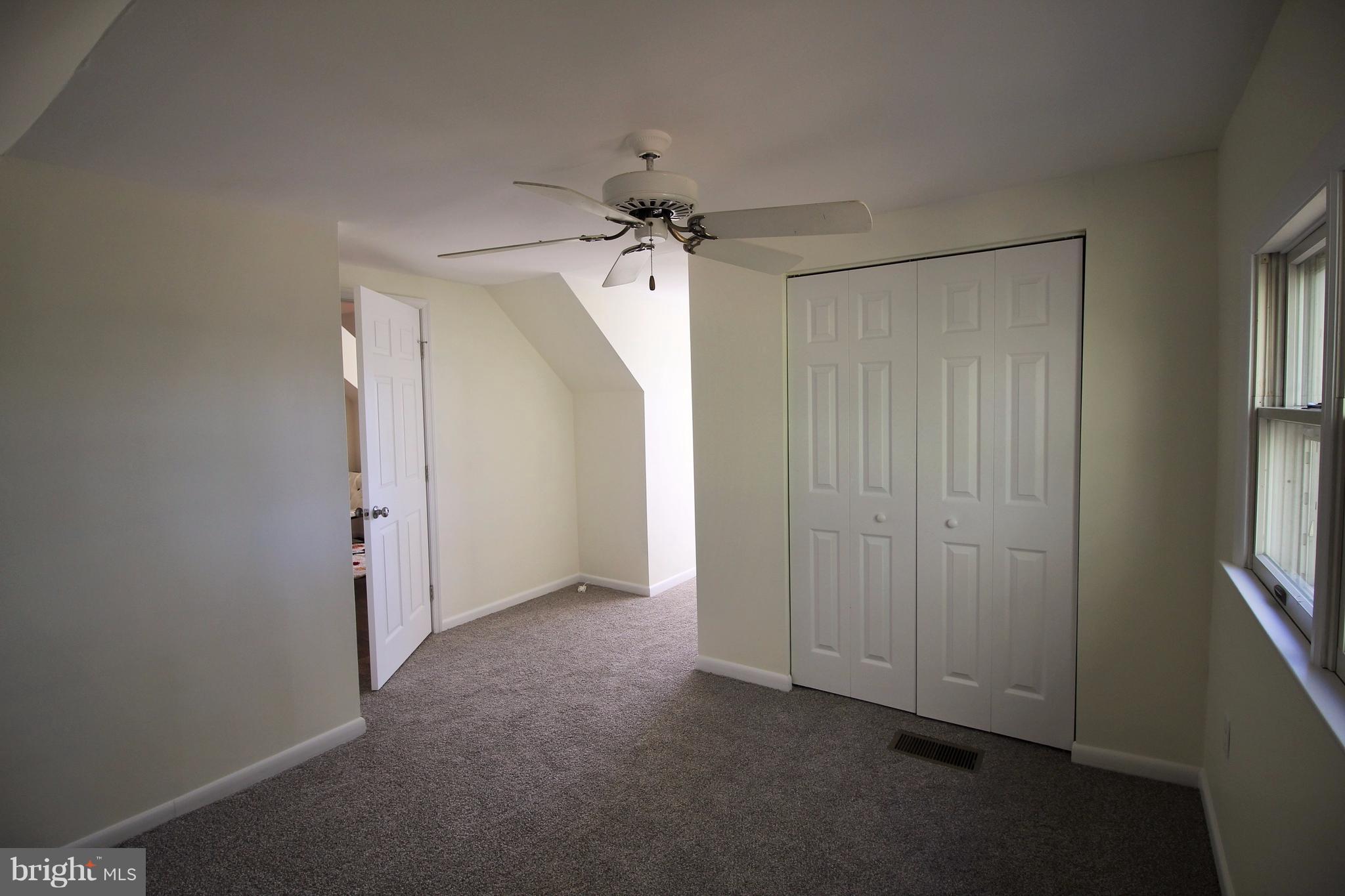 12805 Bunker Hill Road Union Bridge, MD 21791 - Photo 20 of 30 an empty room with windows and fan