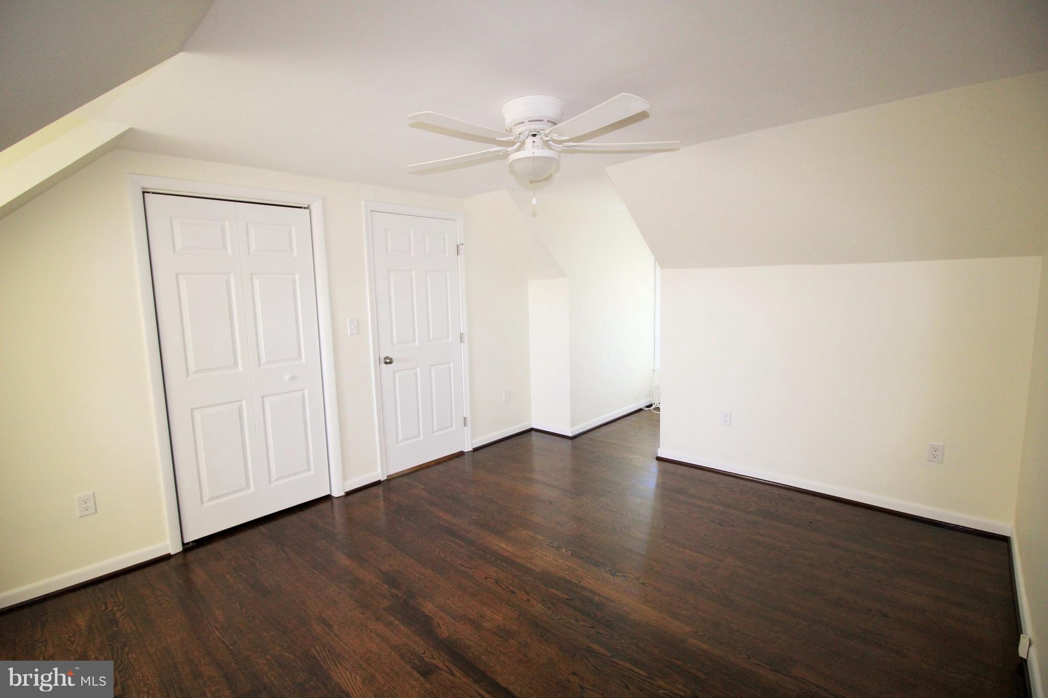 12805 Bunker Hill Road Union Bridge, MD 21791 - Photo 24 of 30 an empty room with wooden floor and fan