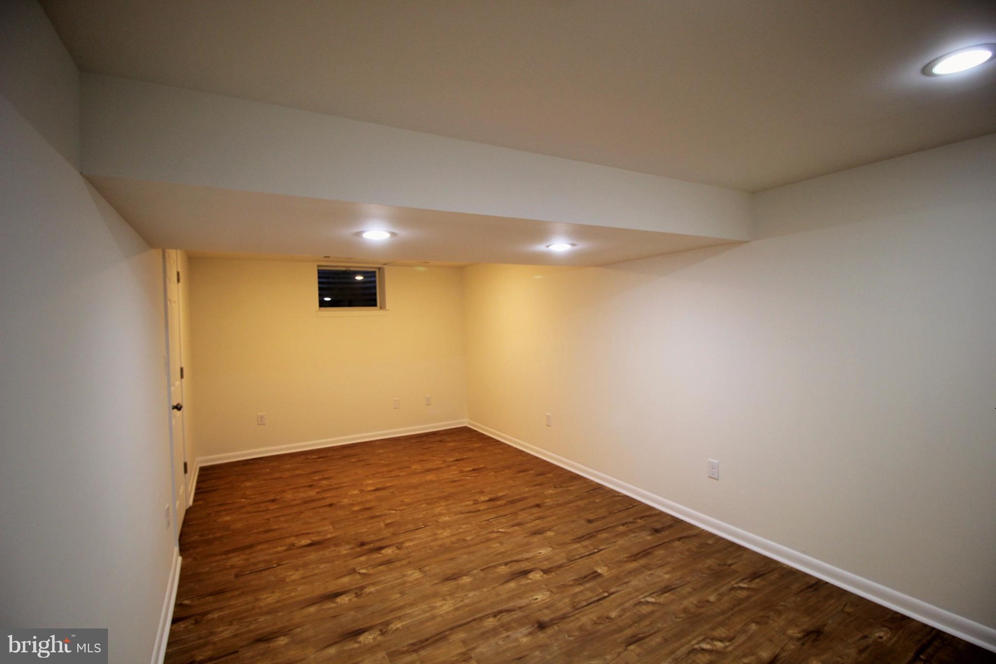 12805 Bunker Hill Road Union Bridge, MD 21791 - Photo 25 of 30 an empty room with wooden floor and windows