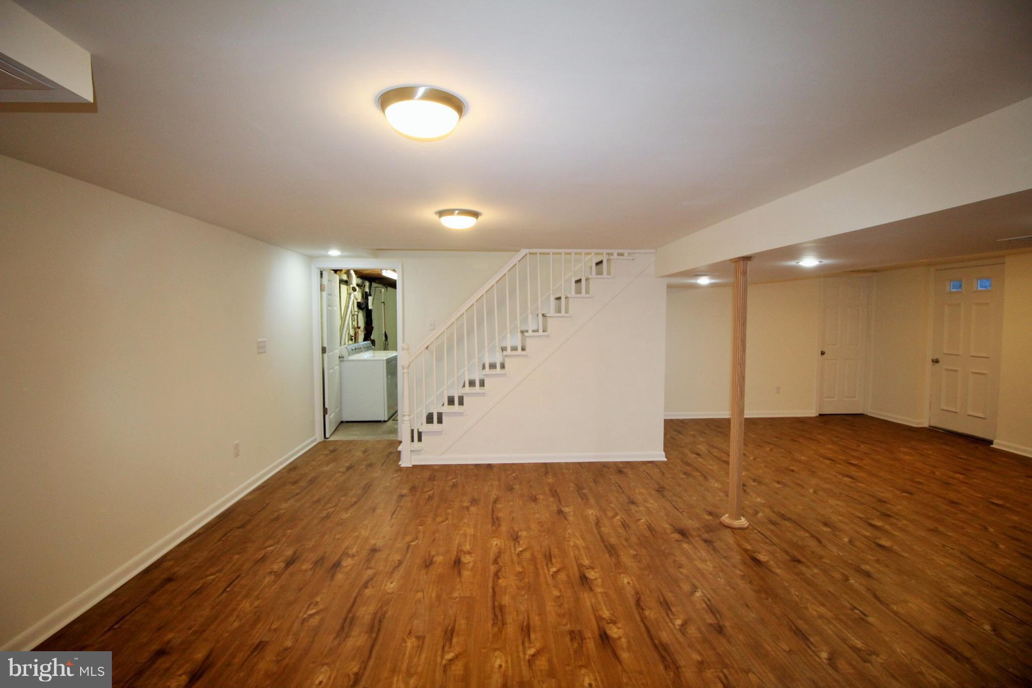 12805 Bunker Hill Road Union Bridge, MD 21791 - Photo 26 of 30 an empty room with wooden floor and entryway